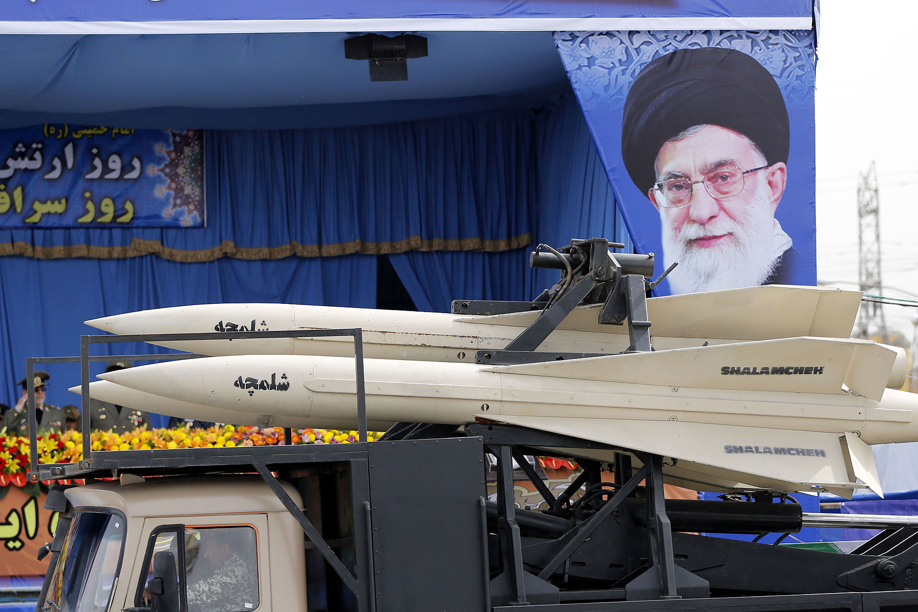 A military truck carrying Shalamcheh missiles drives past the presidential rostrum during the annual Army Day military parade on April 18, 2014 in Tehran