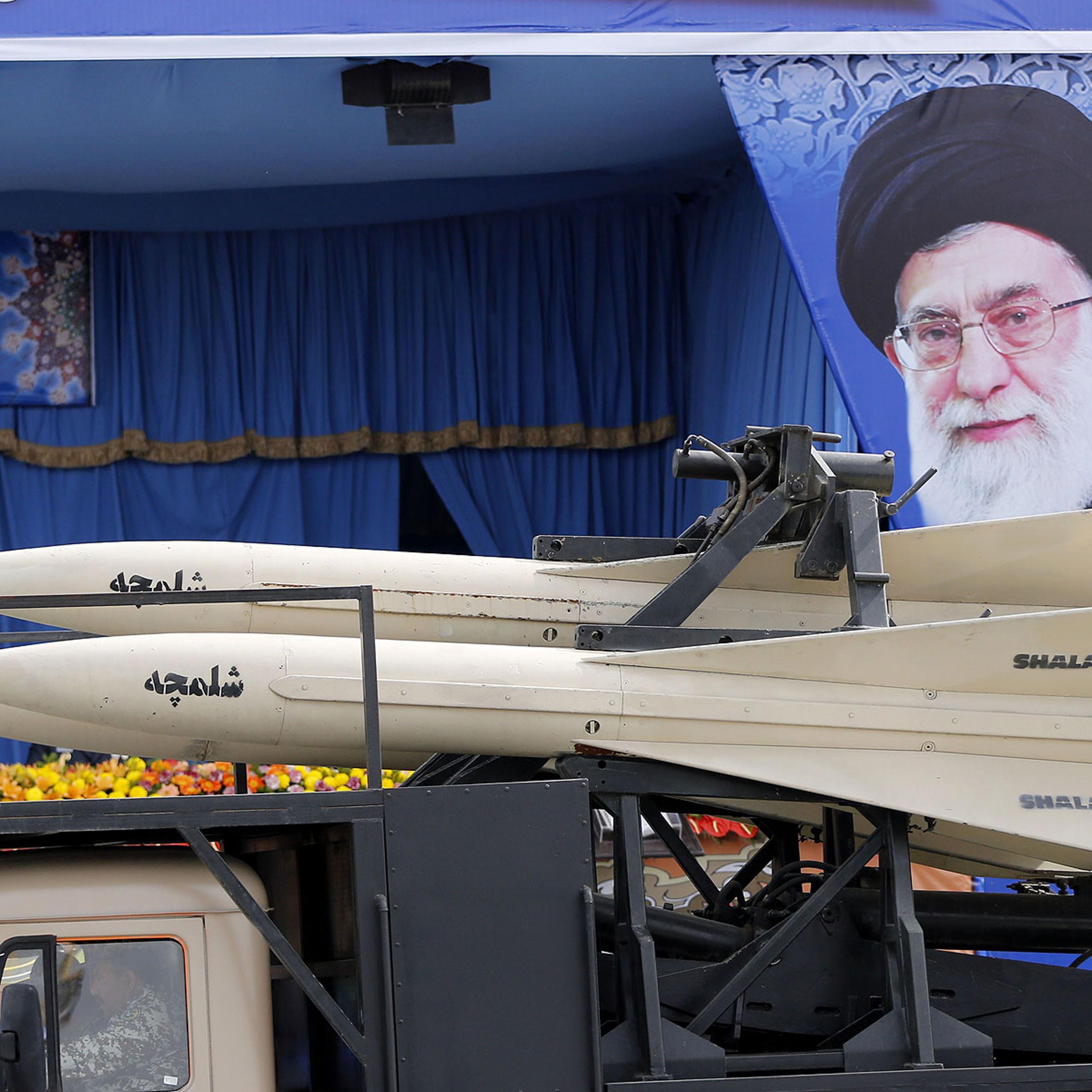 A military truck carrying Shalamcheh missiles drives past the presidential rostrum during the annual Army Day military parade on April 18, 2014 in Tehran