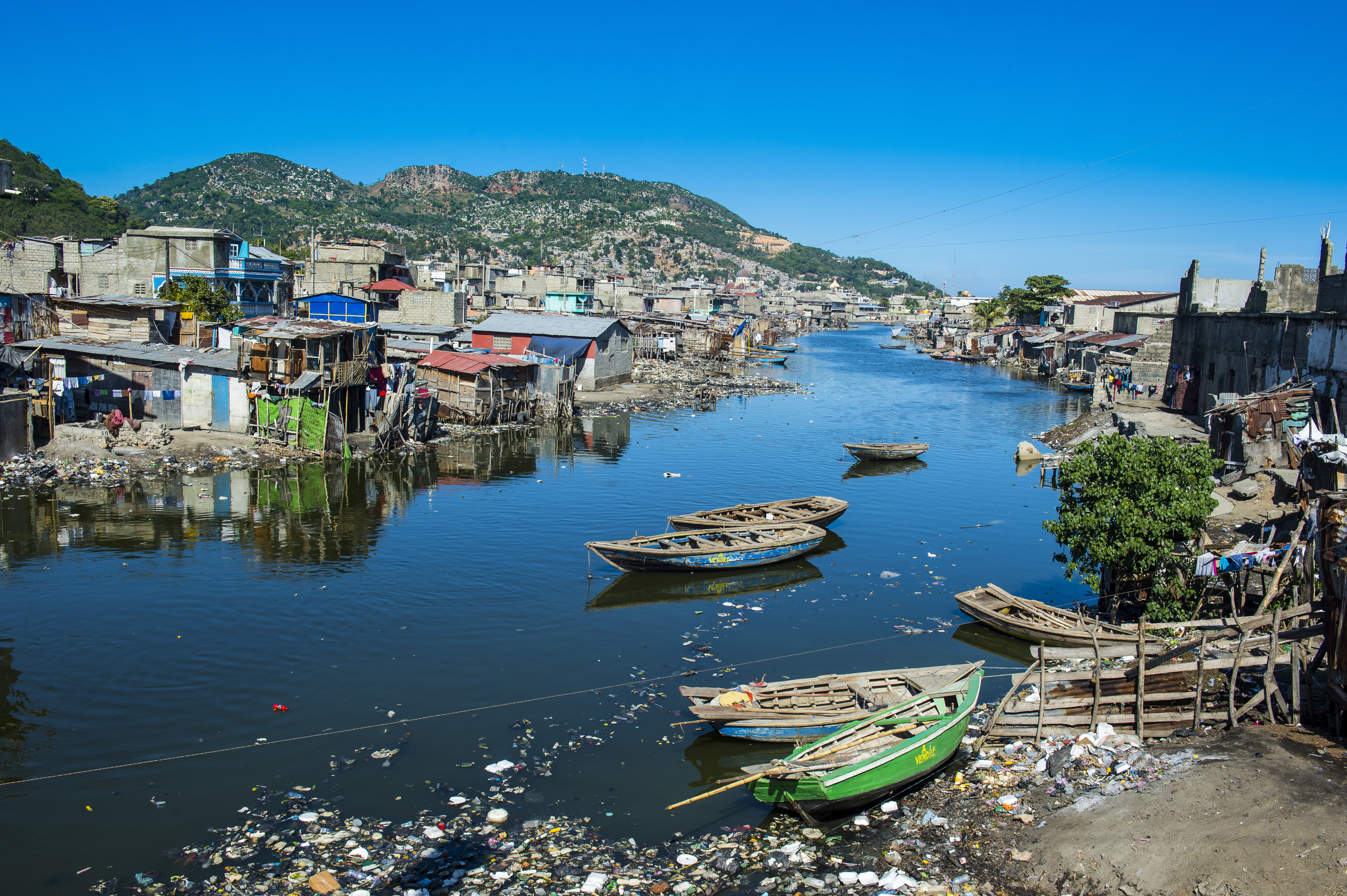 Totally polluted River Mapou flowing through Cap Haitien, Haiti, Caribbean, Central America