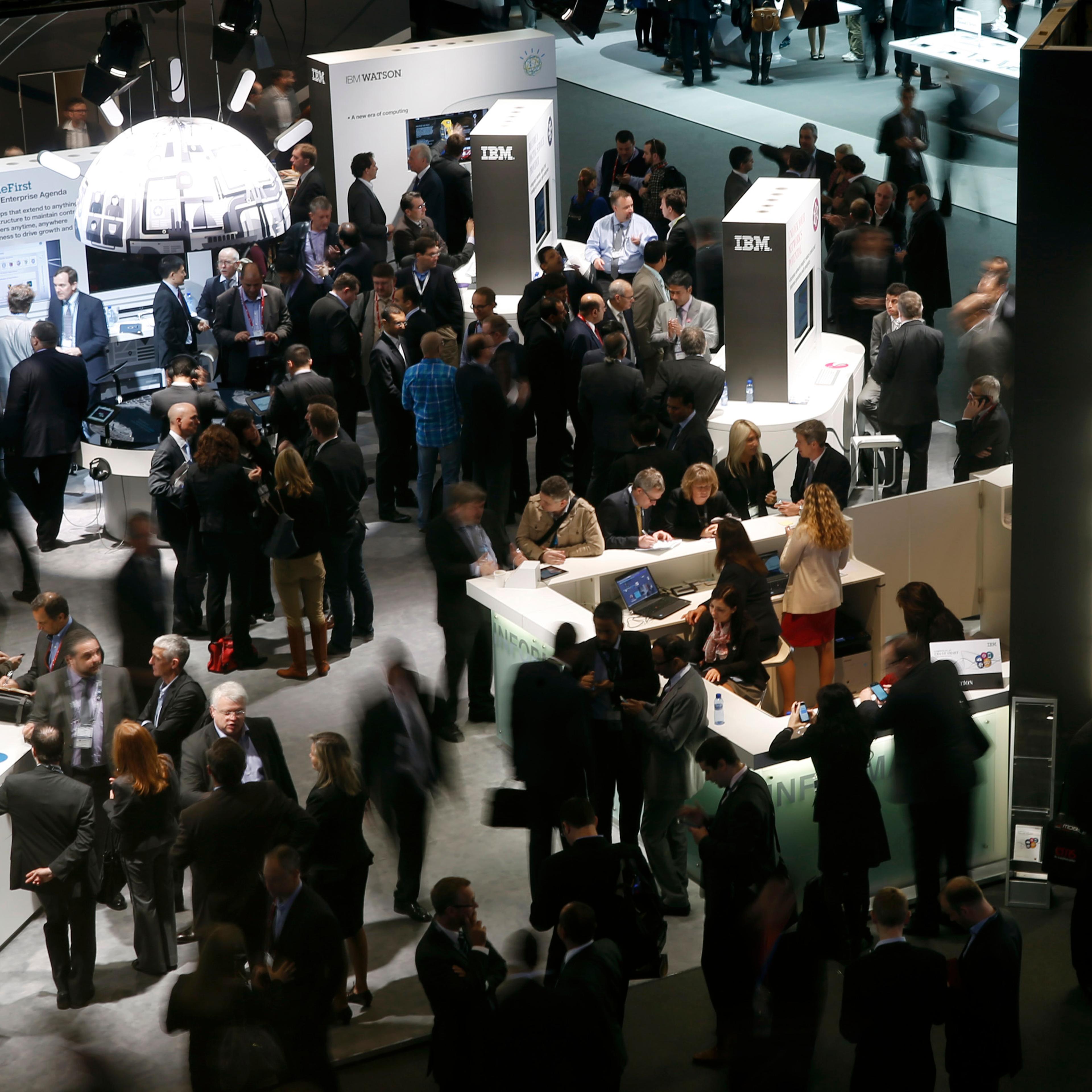 Participants visit the IBM stand at the Mobile World Congress in Barcelona