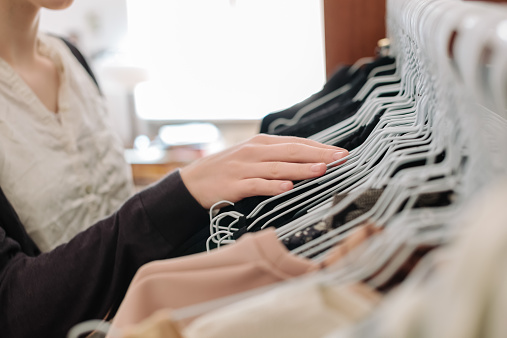 woman-looking-wardrobe-clothes