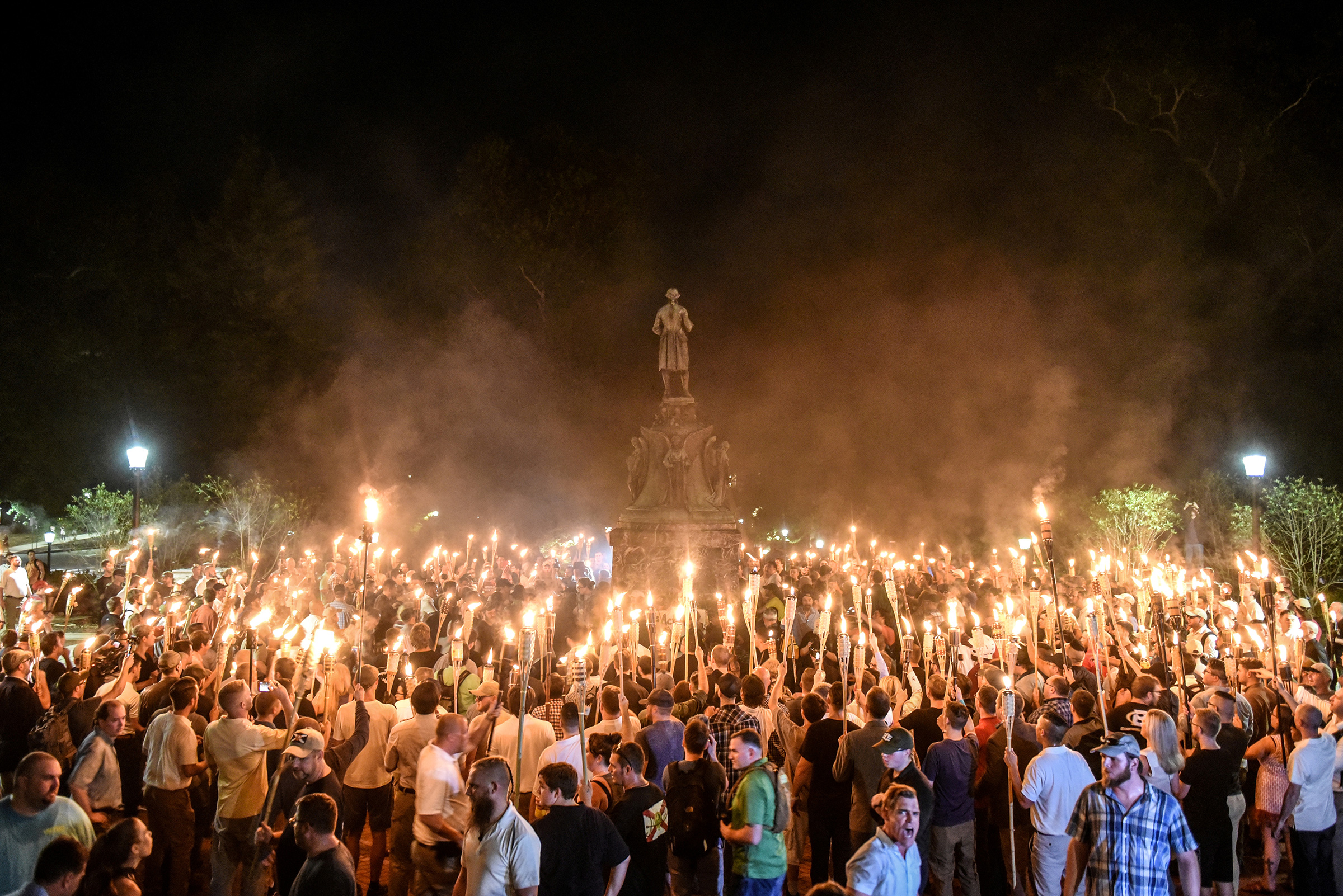 White nationalists participate in a torch-lit march on the grounds of the University of Virginia ahead of the Unite the Right Rally in Charlottesville, Virginia on Aug. 11, 2017