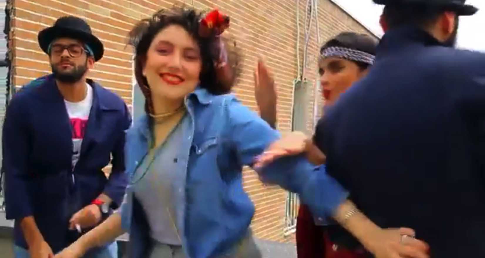 In this frame grab taken from video posted to YouTube, people dance to Pharrell Williams' hit song "Happy" on a rooftop in Tehran