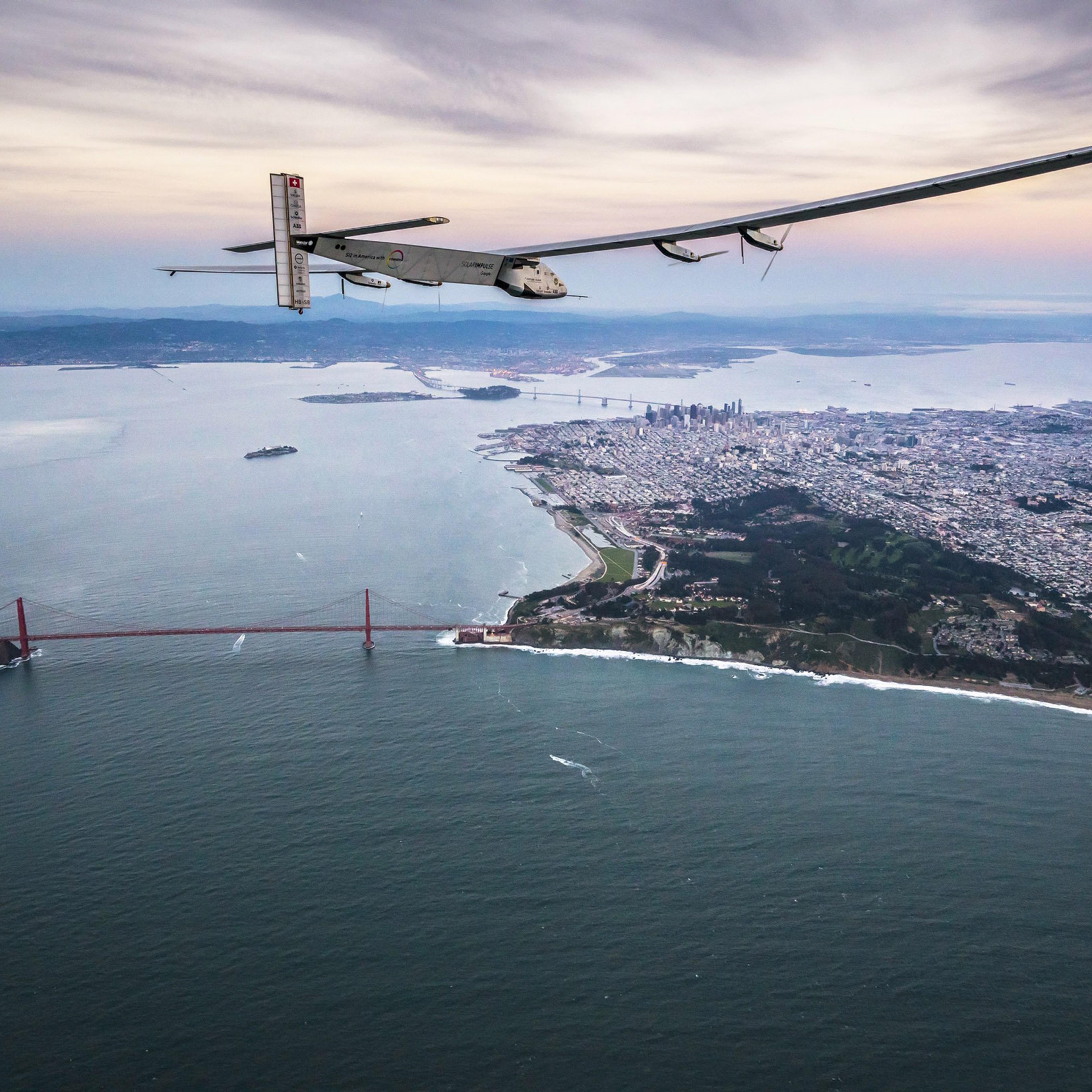 SAN FRANCISCO, CA - APRIL 23: In this handout image supplied by Jean Revillard, Solar powered plane 'Solar Impulse 2', piloted by Swiss adventurer Bertrand Piccard, flys over the Golden Gate bridge in San Francisco, after a flight from Hawaii during its