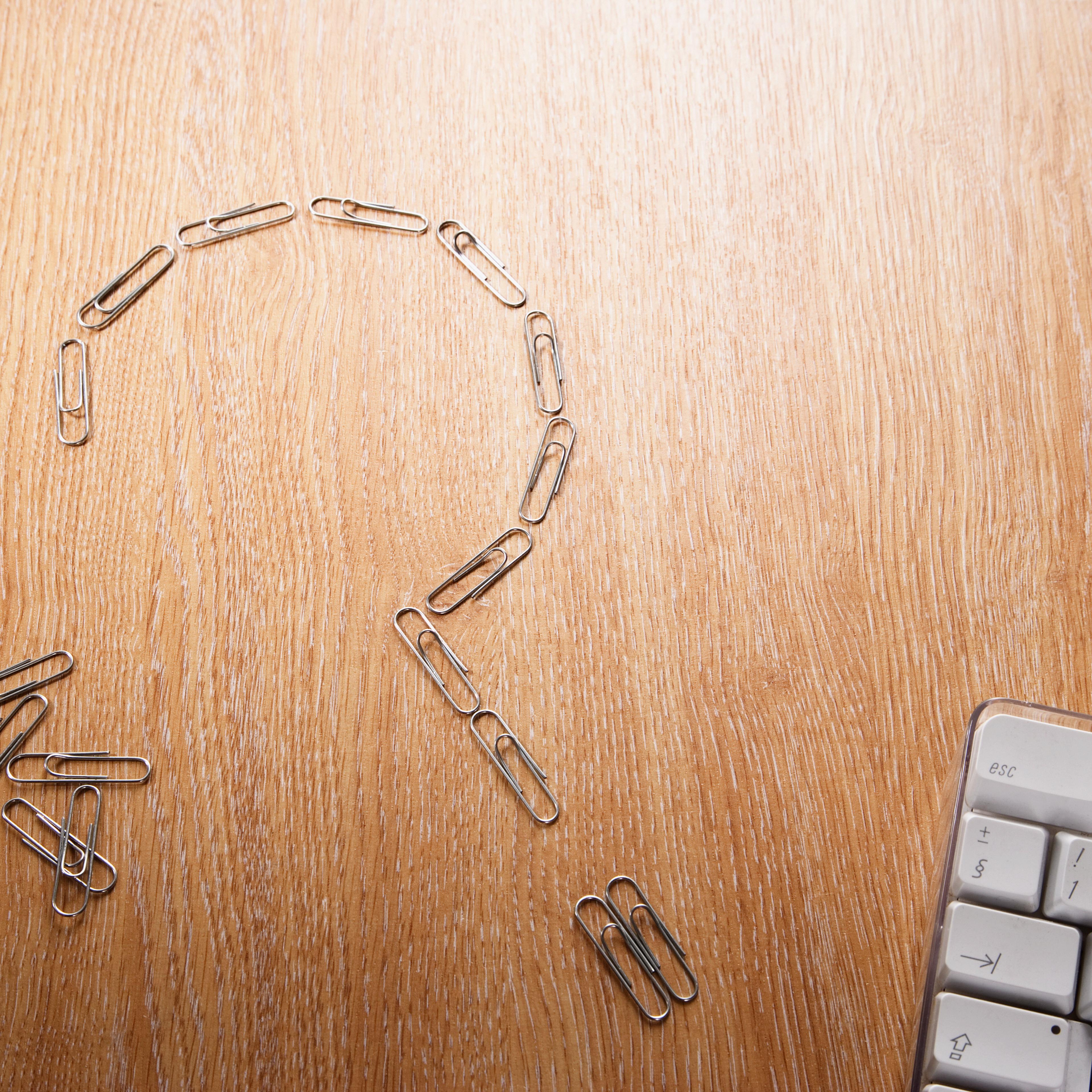 Close up of paperclips in shape of question mark