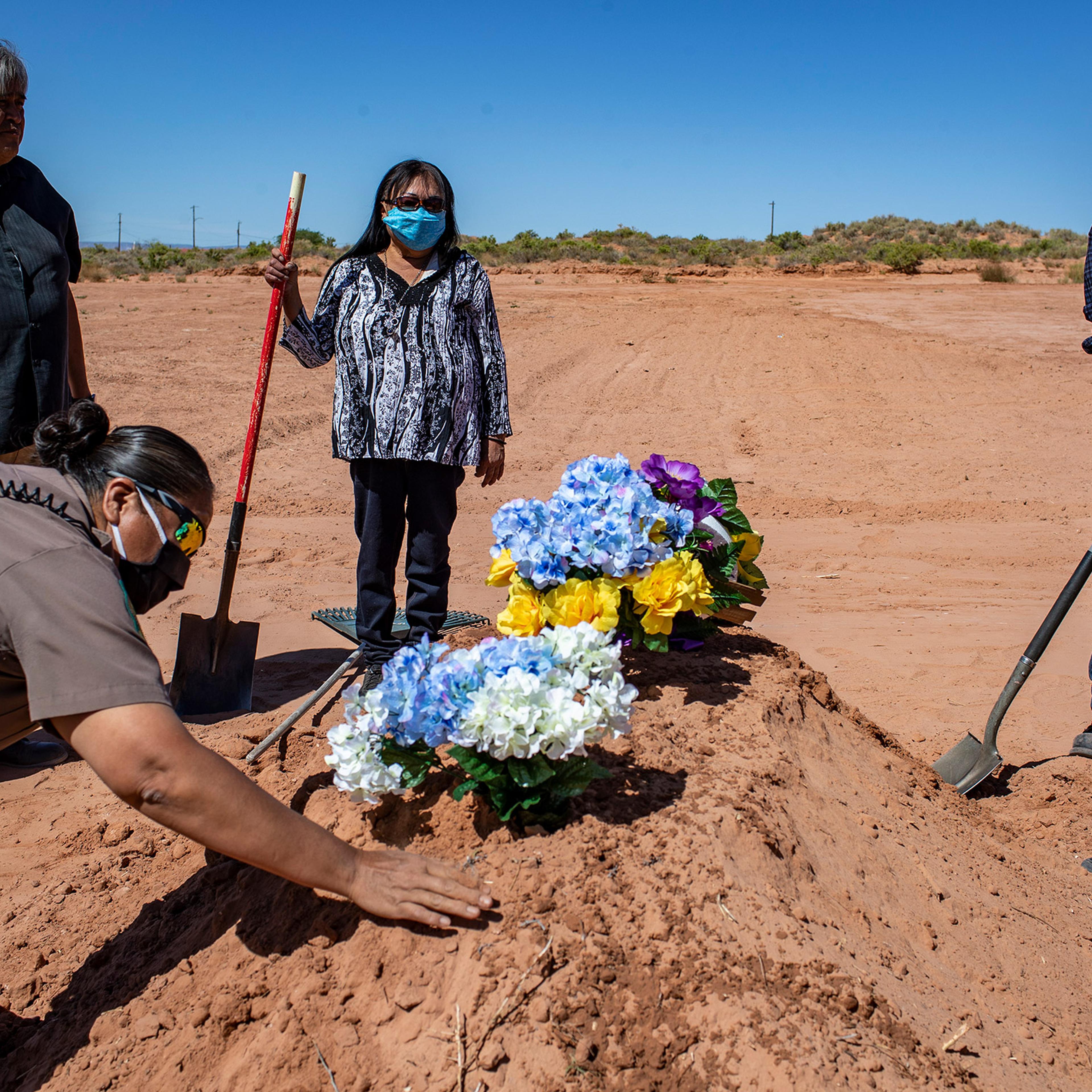 A funeral is held for Arnold Billy, who was a victim of COVID-19, at Tuba City Community Cemetery in Tuba City, Ariz., on May 22, 2020.