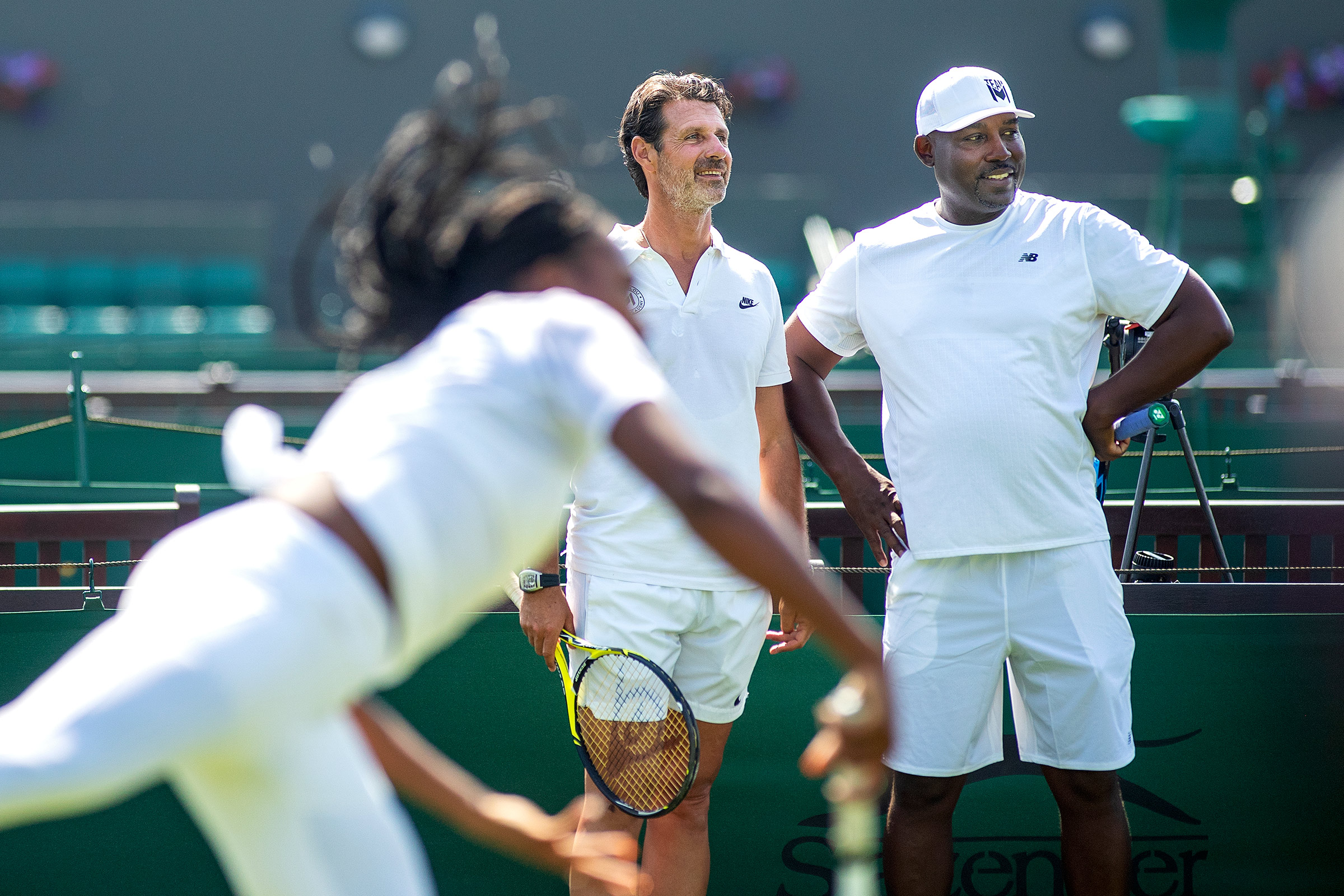 Patrick Mouratoglou and Corey Gauff watch Gauff practice before Wimbledon  in June 2019