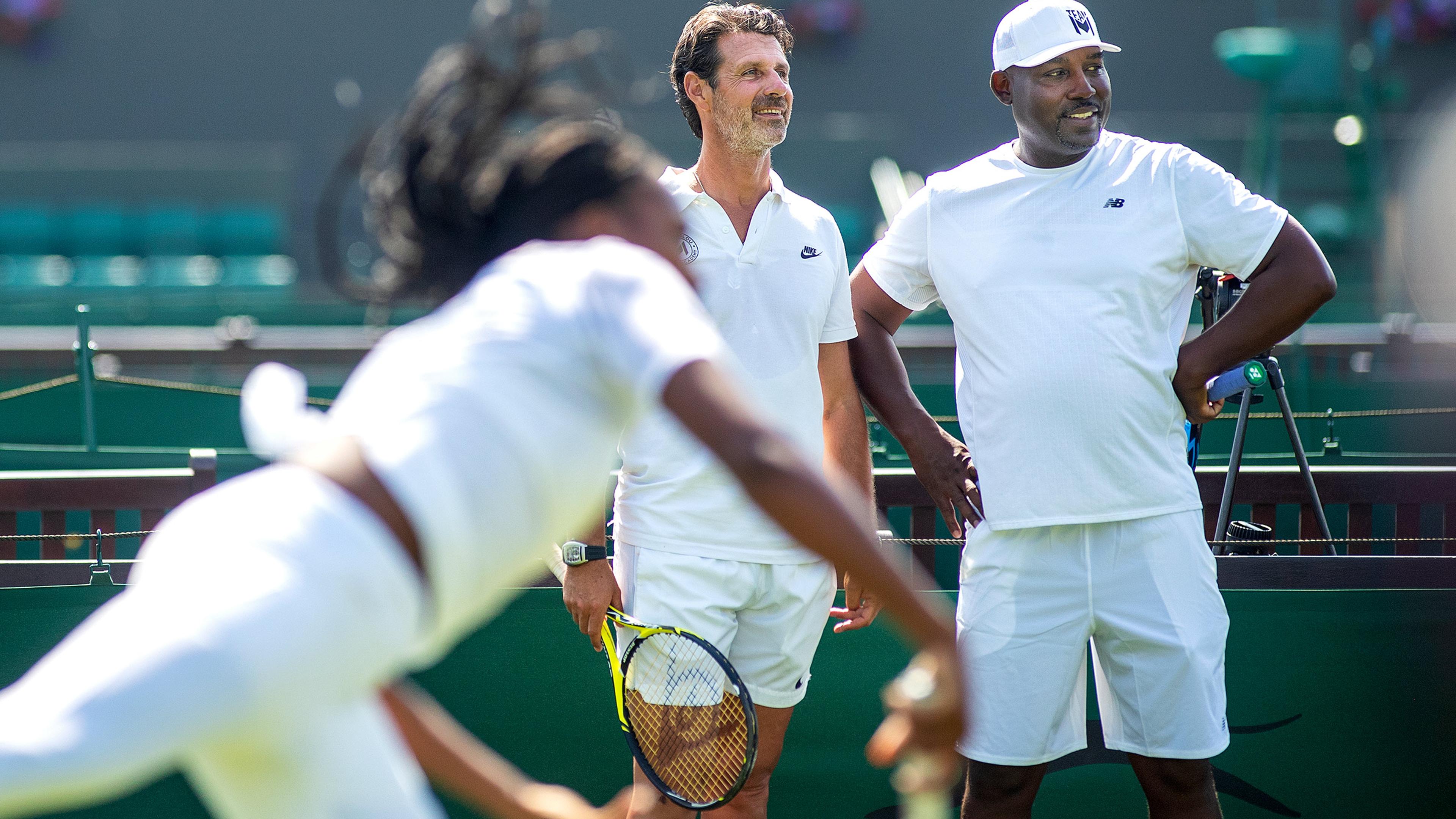 Patrick Mouratoglou and Corey Gauff watch Gauff practice before Wimbledon in June 2019