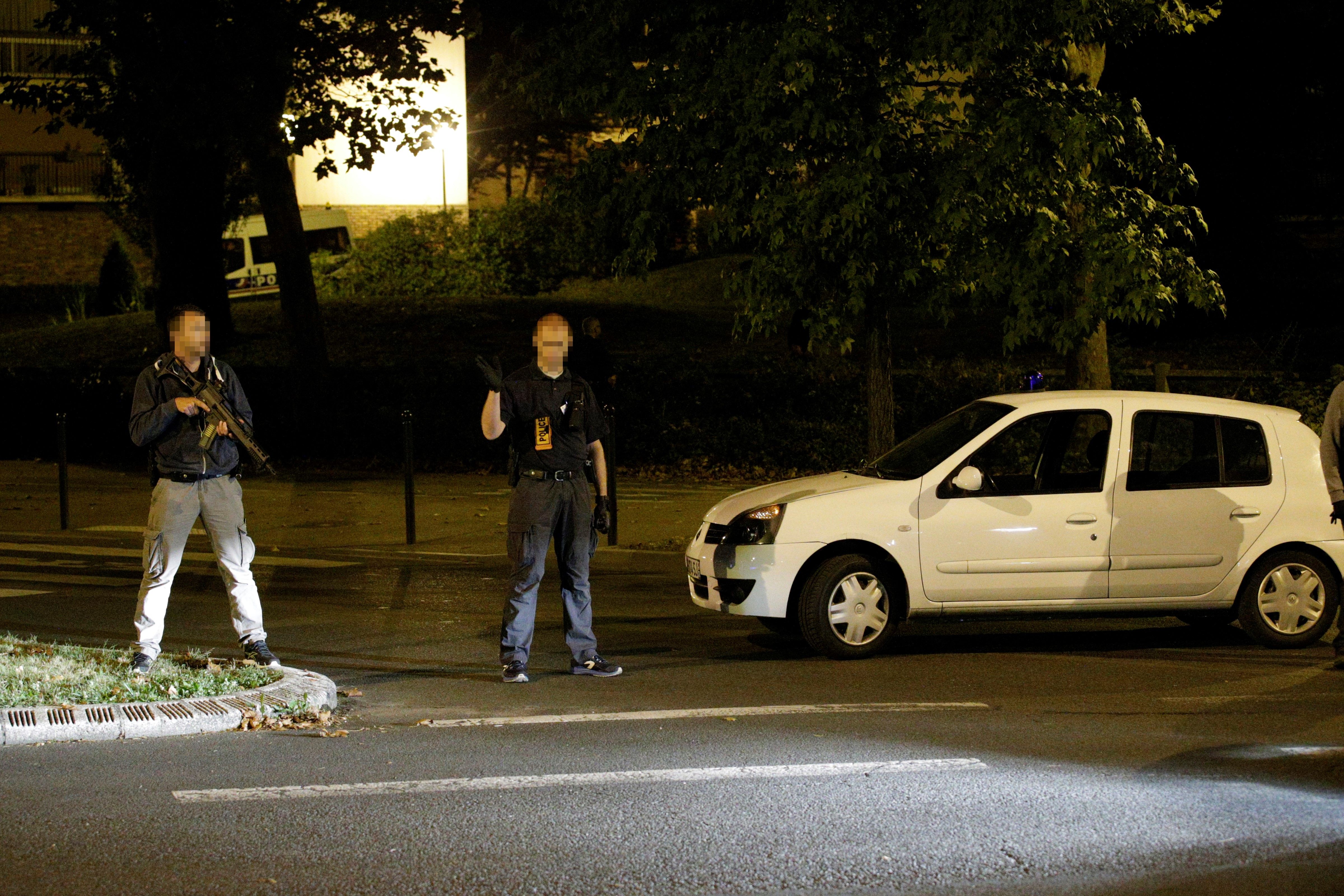 French police forces stand guard outside a building after the arrest of female suspects said to have been planning terrorism attack on Sept. 8, 2016.