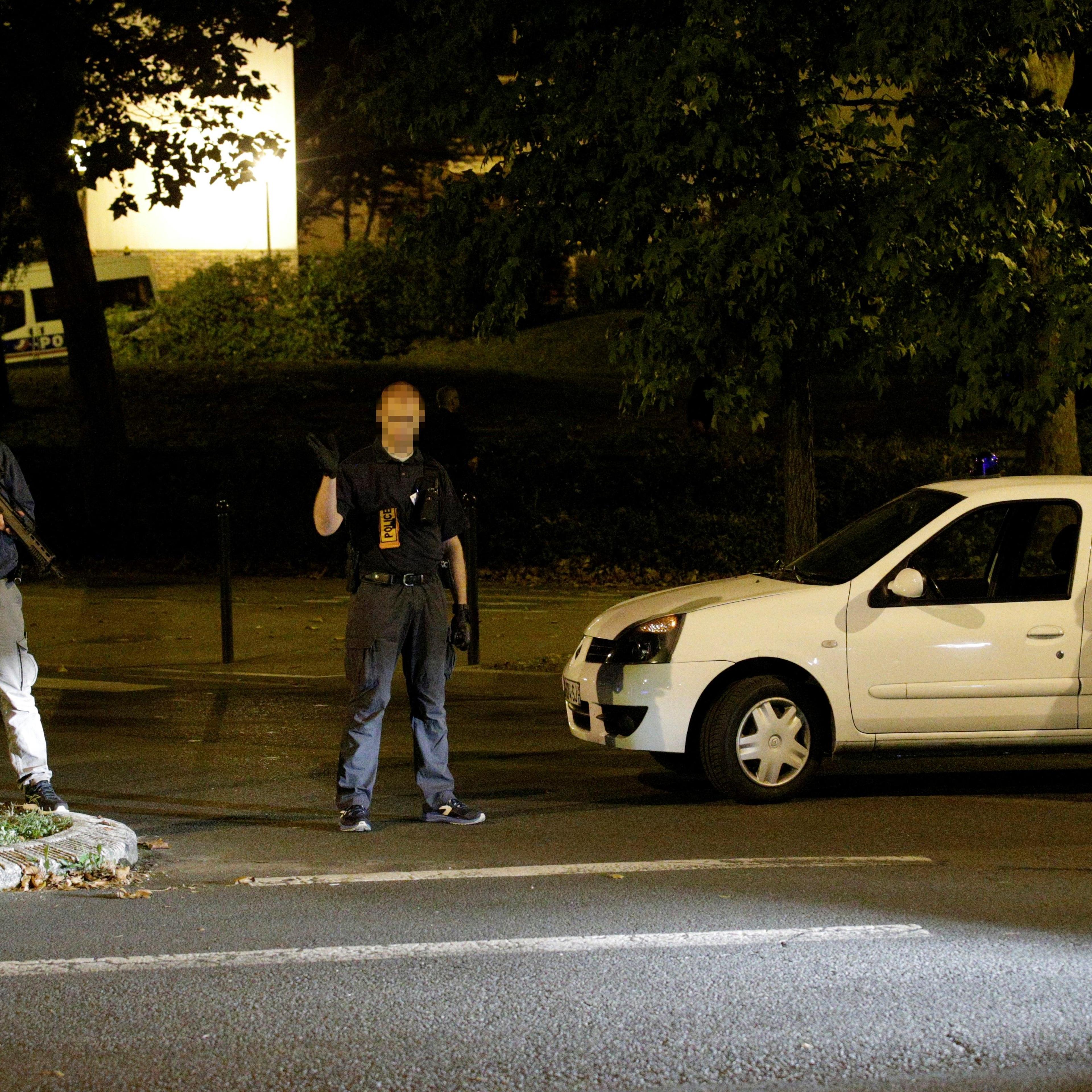 French police forces stand guard outside a building after the arrest of female suspects said to have been planning terrorism attack on Sept. 8, 2016.