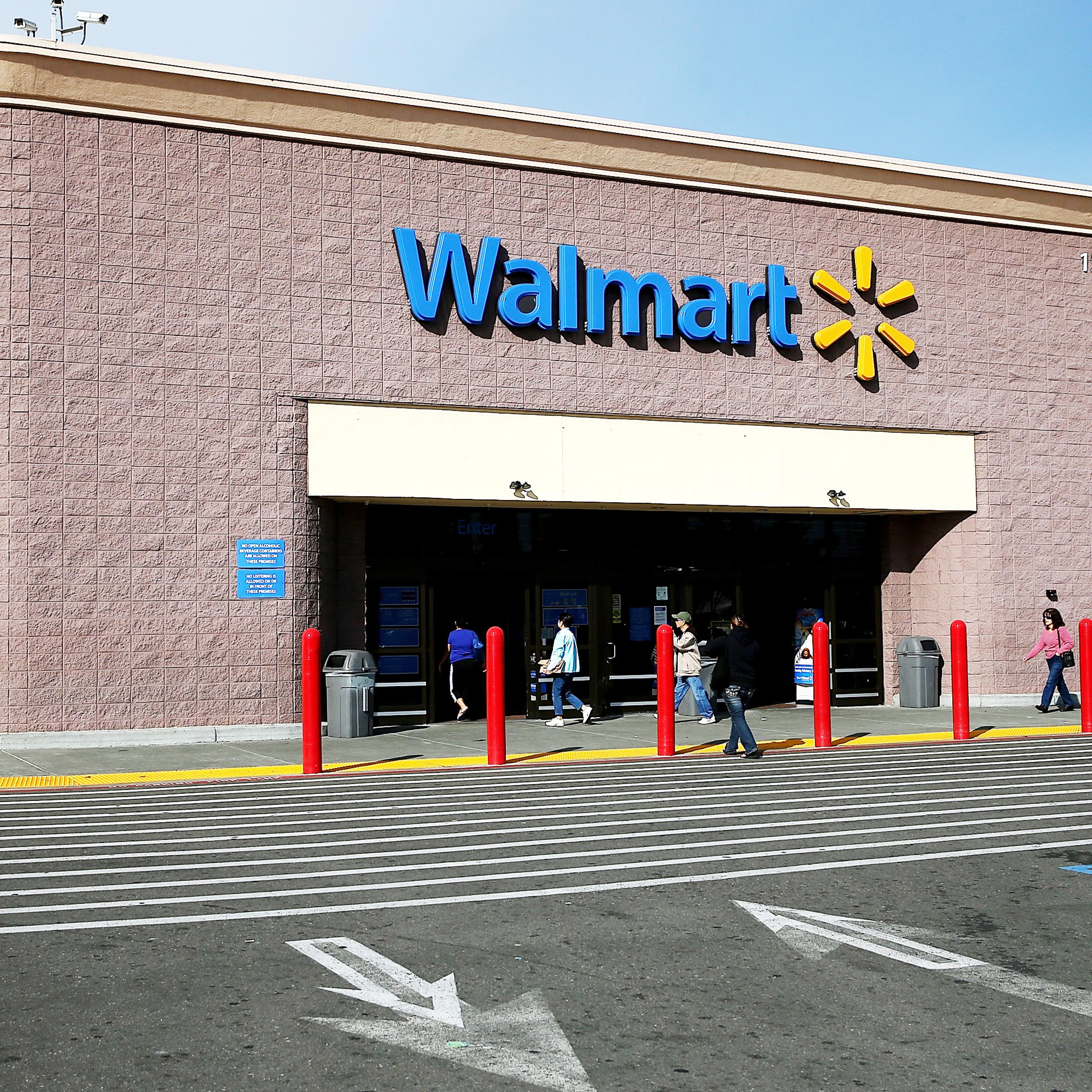 Customers enter a Wal-Mart store on Feb. 20, 2014 in San Lorenzo, Calif.