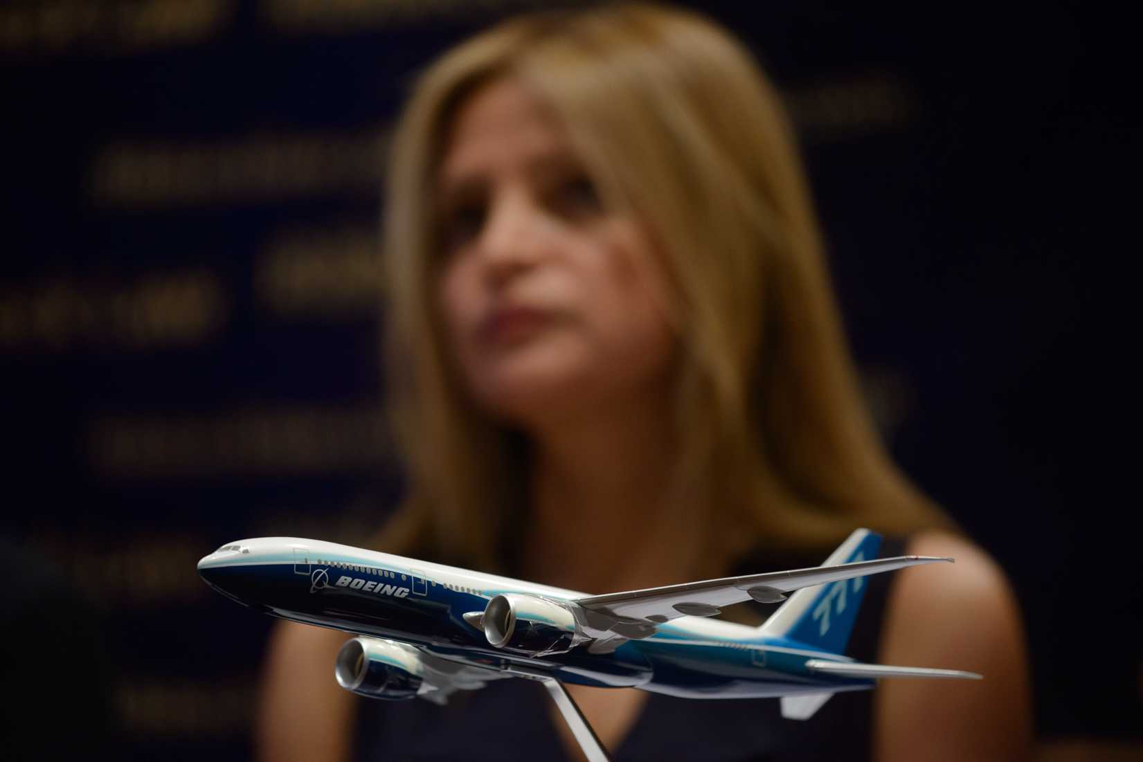 A model of a Boeing 777 aircraft is displayed as Monica Kelly of U.S. law firm Ribbeck Law attends a media briefing organized by the company at a hotel in Kuala Lumpur on March 26, 2014