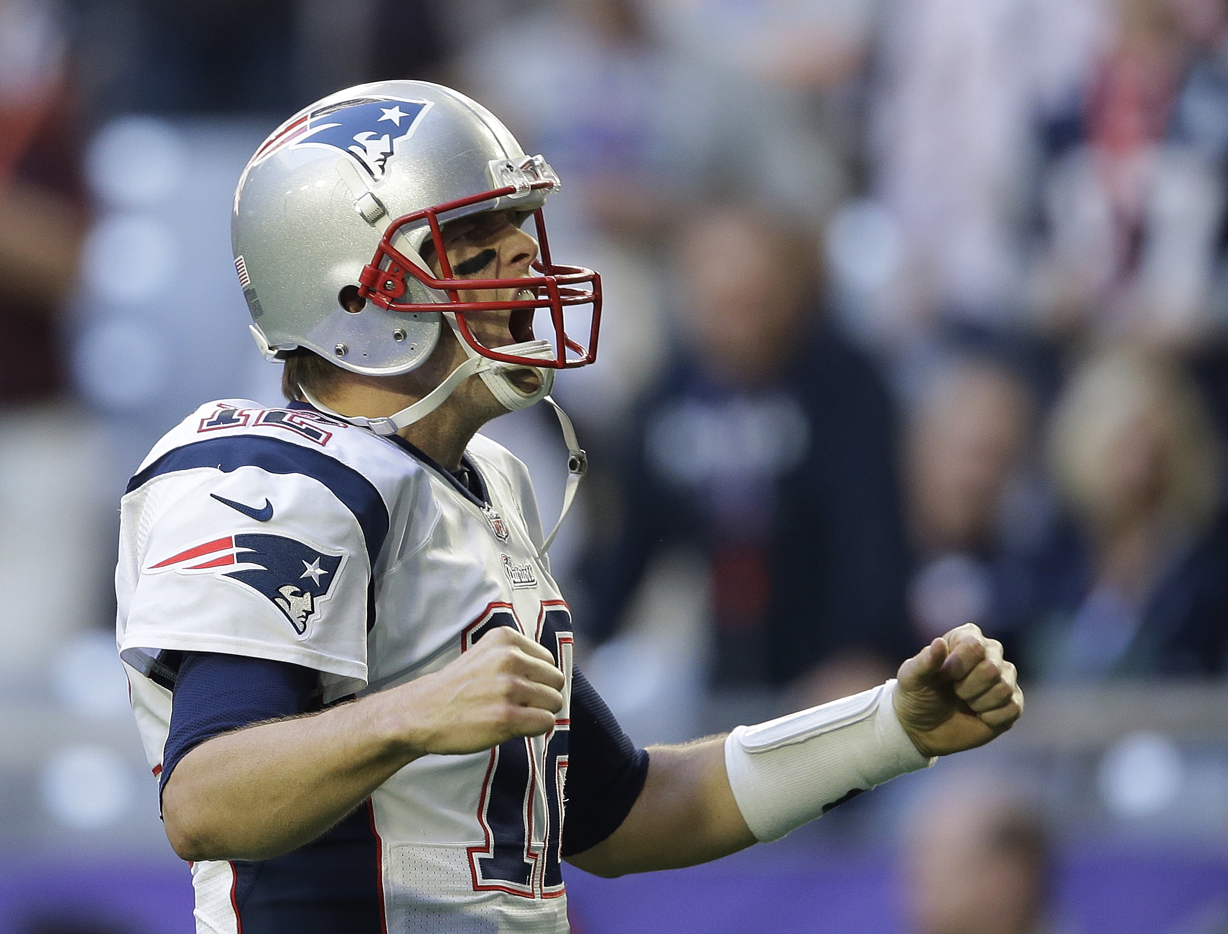 New England Patriots quarterback Tom Brady (12) yells before the NFL Super Bowl XLIX football game against the Seattle Seahawks on Sunday, Feb. 1, 2015, in Glendale, Ariz