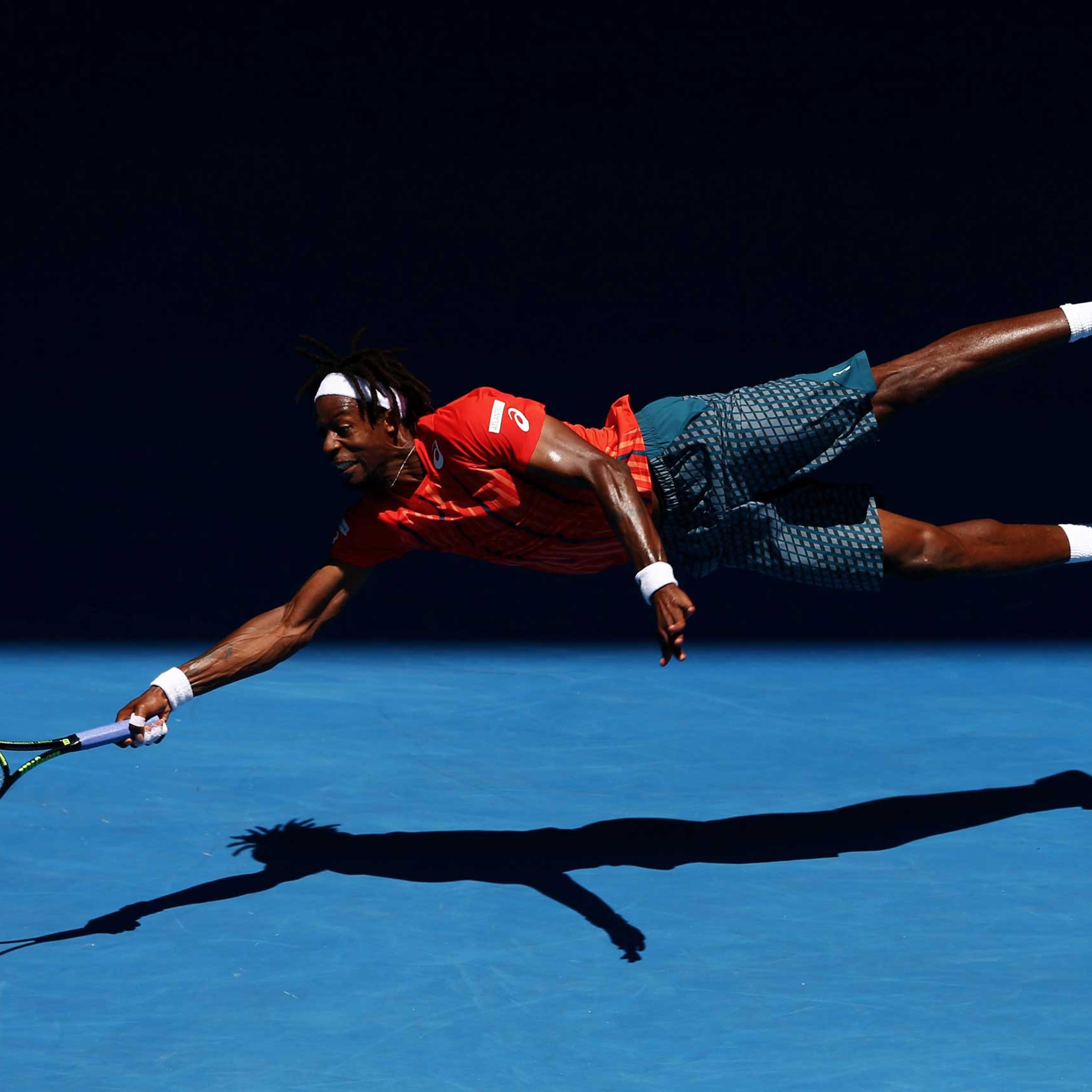 Gael Monfils of France dives for a forehand in his fourth round match against Andrey Kuznestov of Russia, during the 2016 Australian Open at Melbourne Park, Australia, on Jan. 25, 2016.