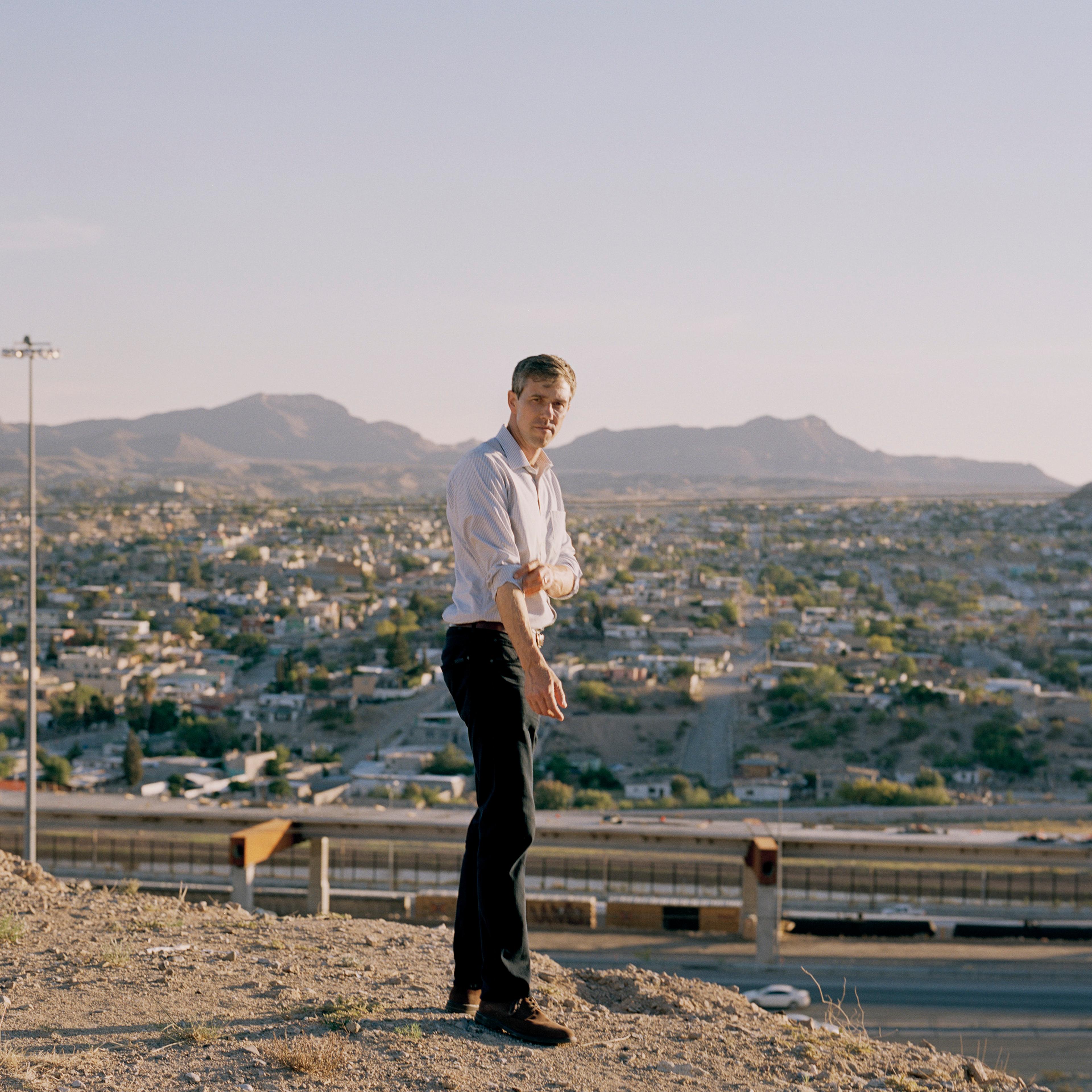 Beto O'Rourke stands with the border between El Paso and Juarez behind him
