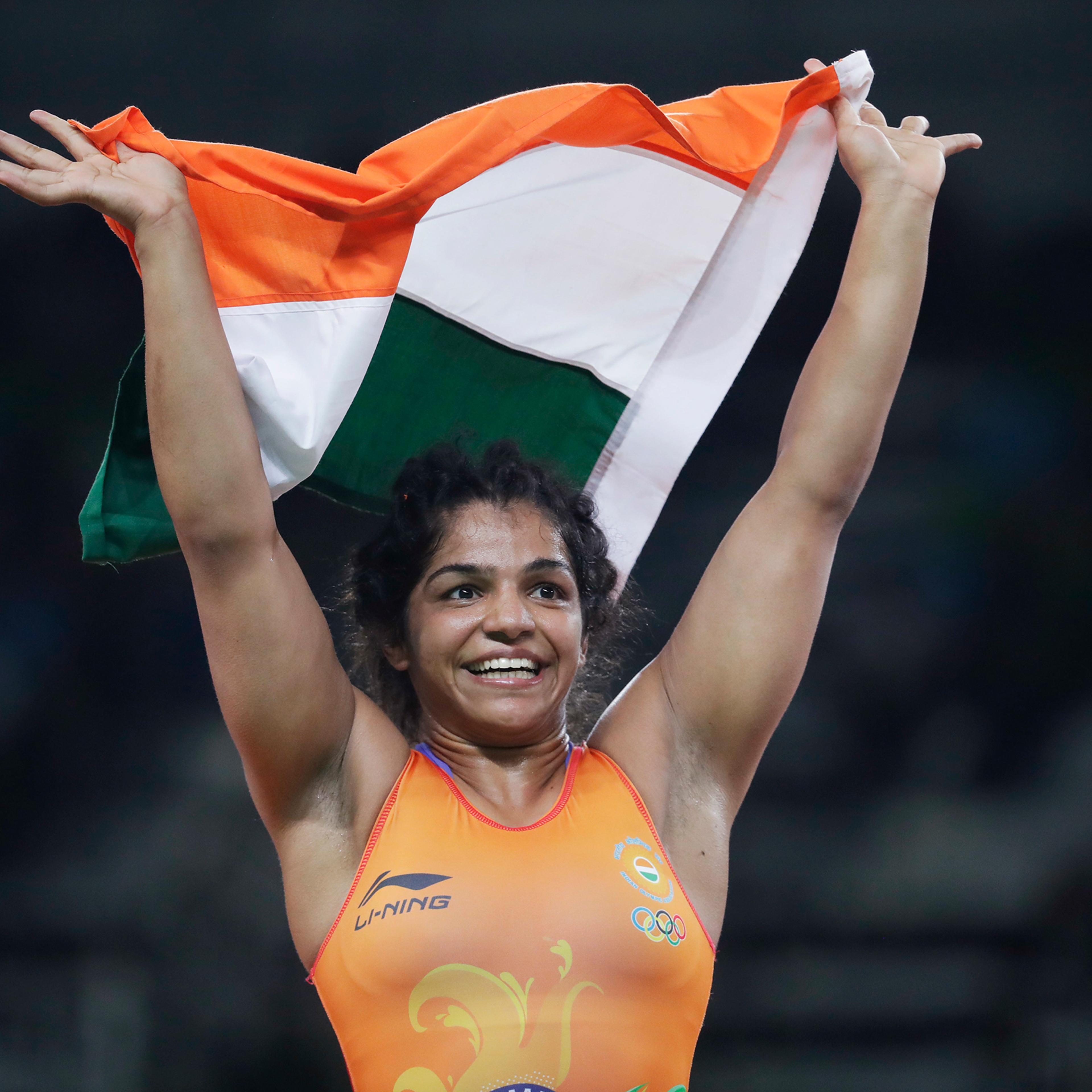 India's Sakshi Malik reacts after winning bronze against Kyrgyzstan's Aisuluu Tynybekova in the women's wrestling freestyle 58-kg competition at the 2016 Summer Olympics in Rio de Janeiro on Aug. 17, 2016.