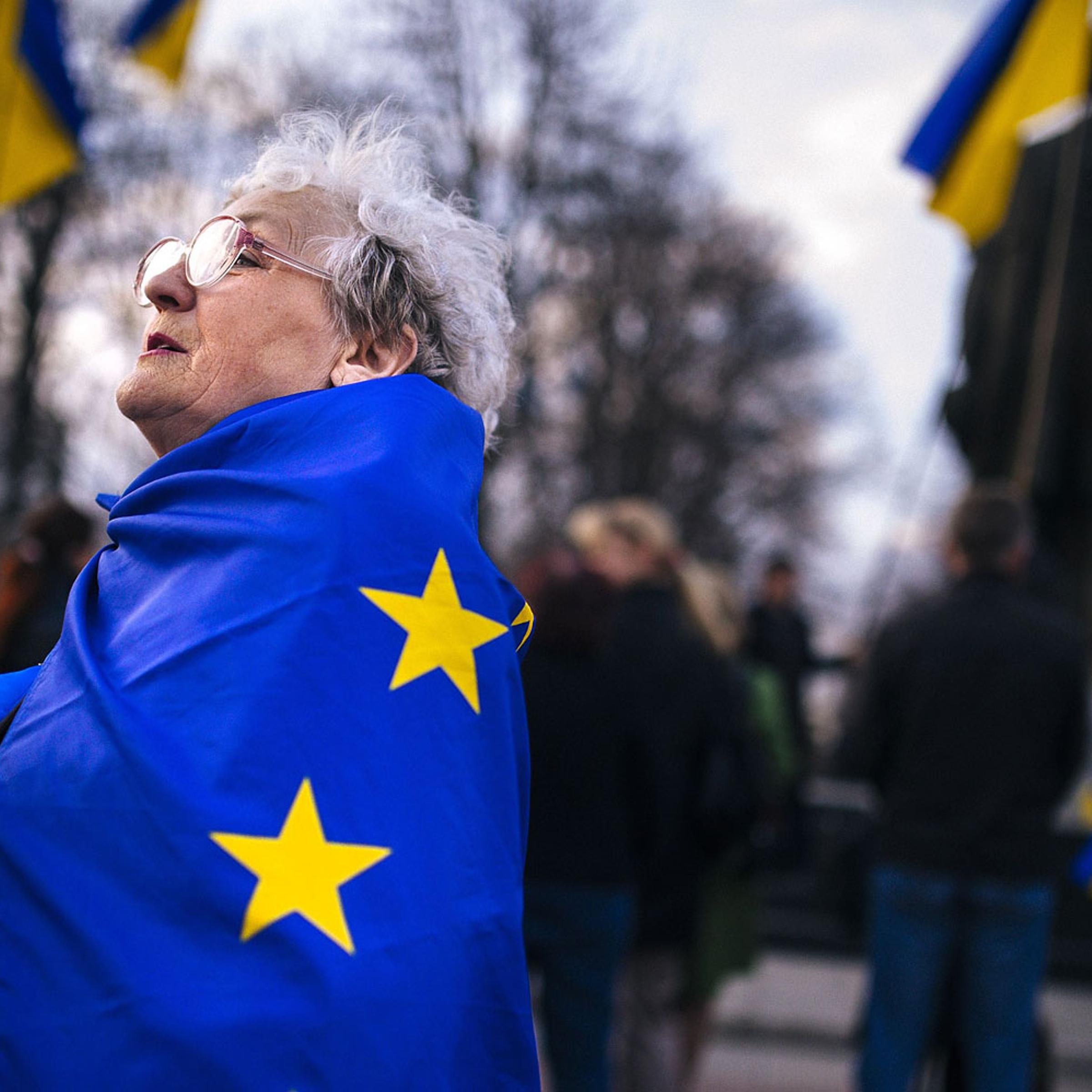 An elderly woman wrapped with an European Union flag attends a pro-Ukraine rally in the eastern Ukrainian city of Lugansk on April 15, 2014.
