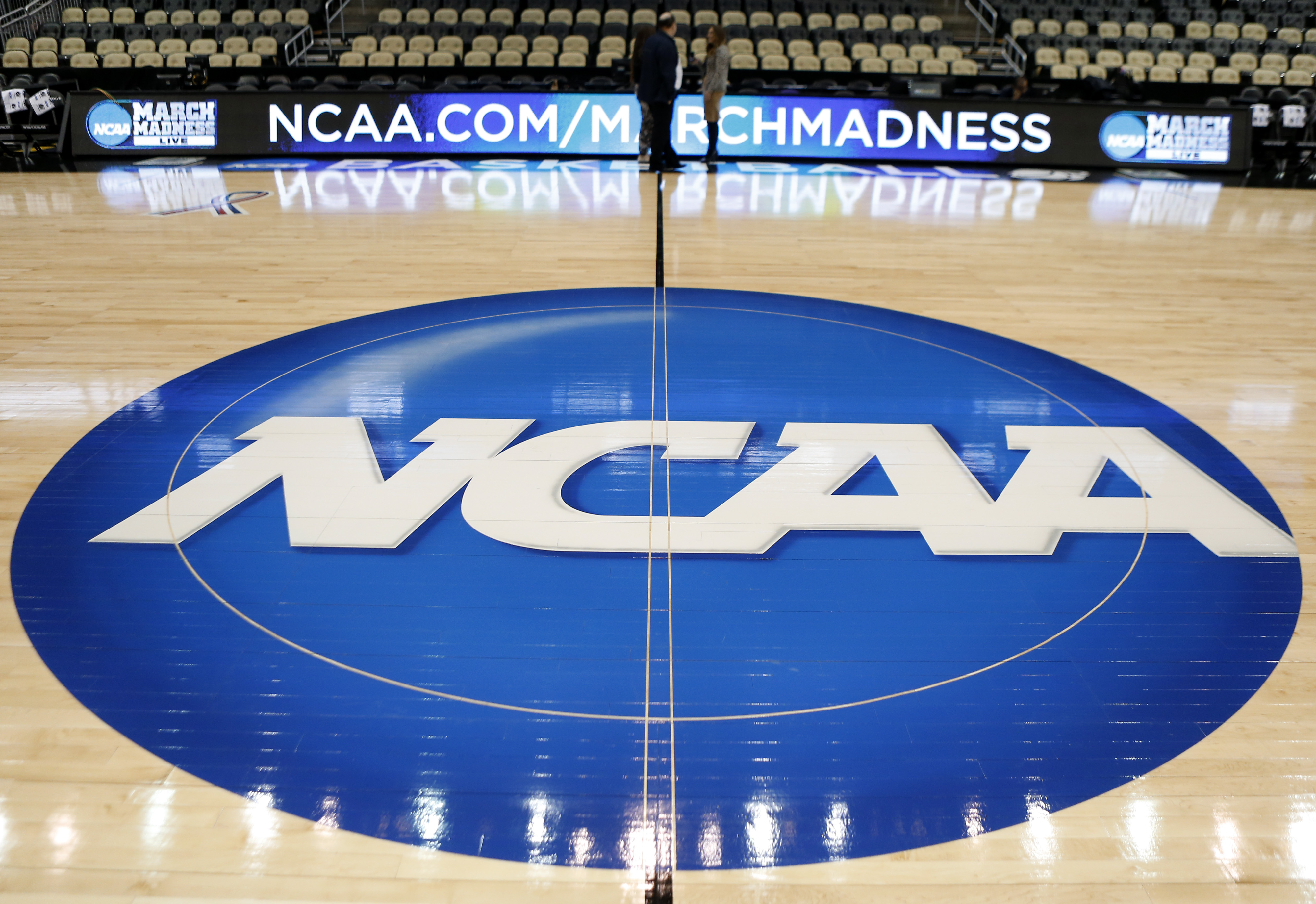 The NCAA logo at center court at The Consol Energy Center in Pittsburgh, March 18, 2015.