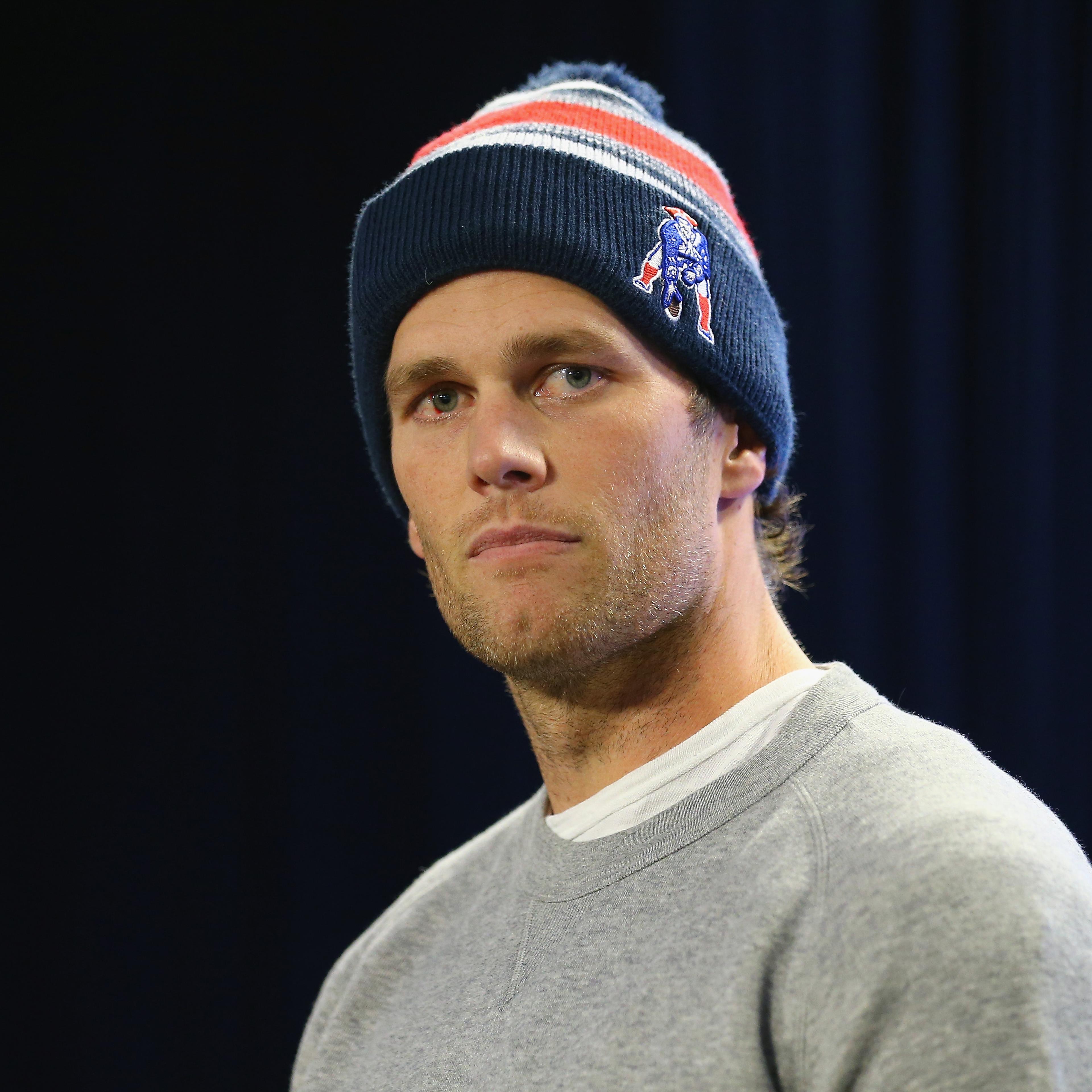 New England Patriots Quarterback Tom Brady talks to the media during a press conference to address the under inflation of footballs used in the AFC championship game at Gillette Stadium on January 22, 2015 in Foxboro, Massachusetts.