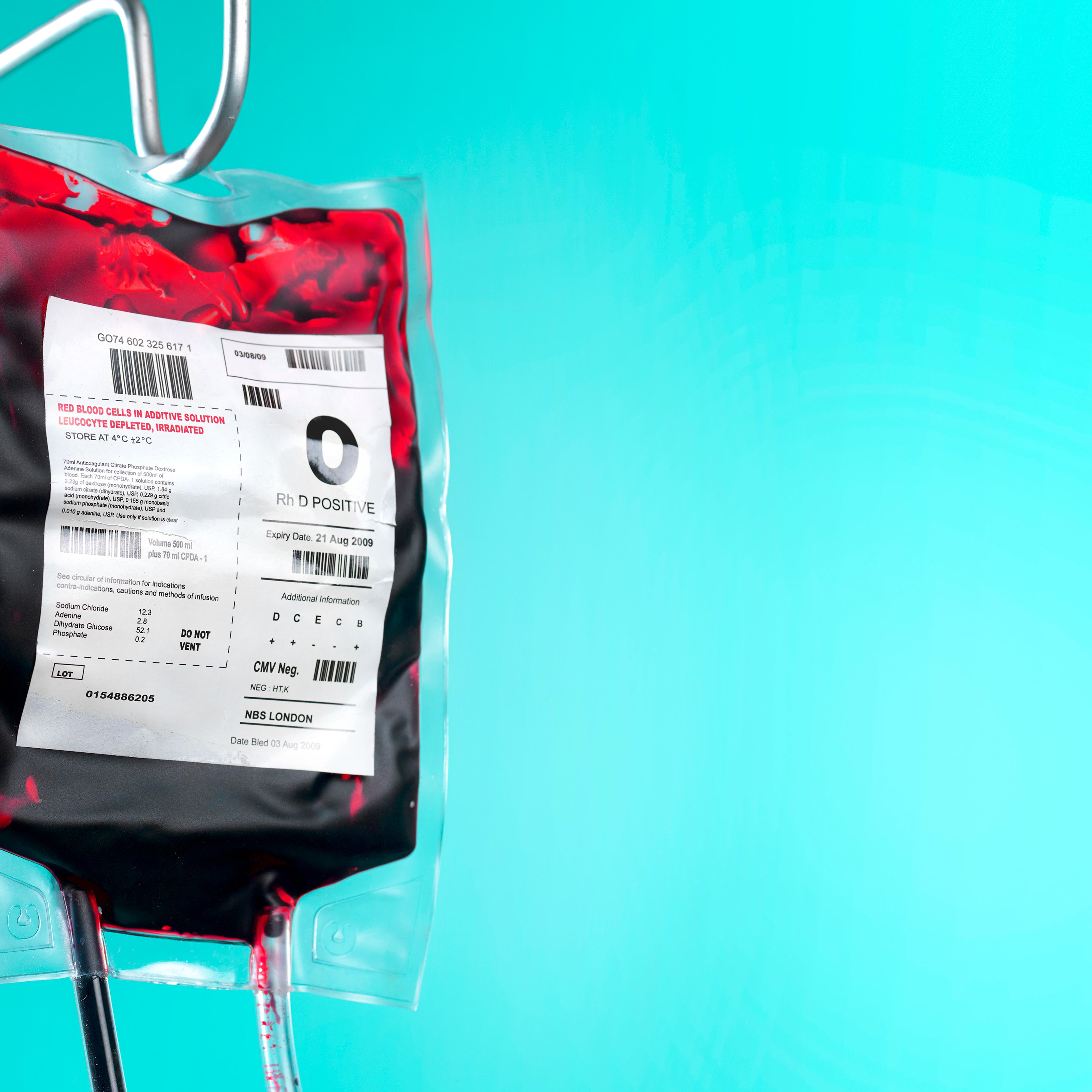 IV blood bag and saline drip on hospital stand with copy space
