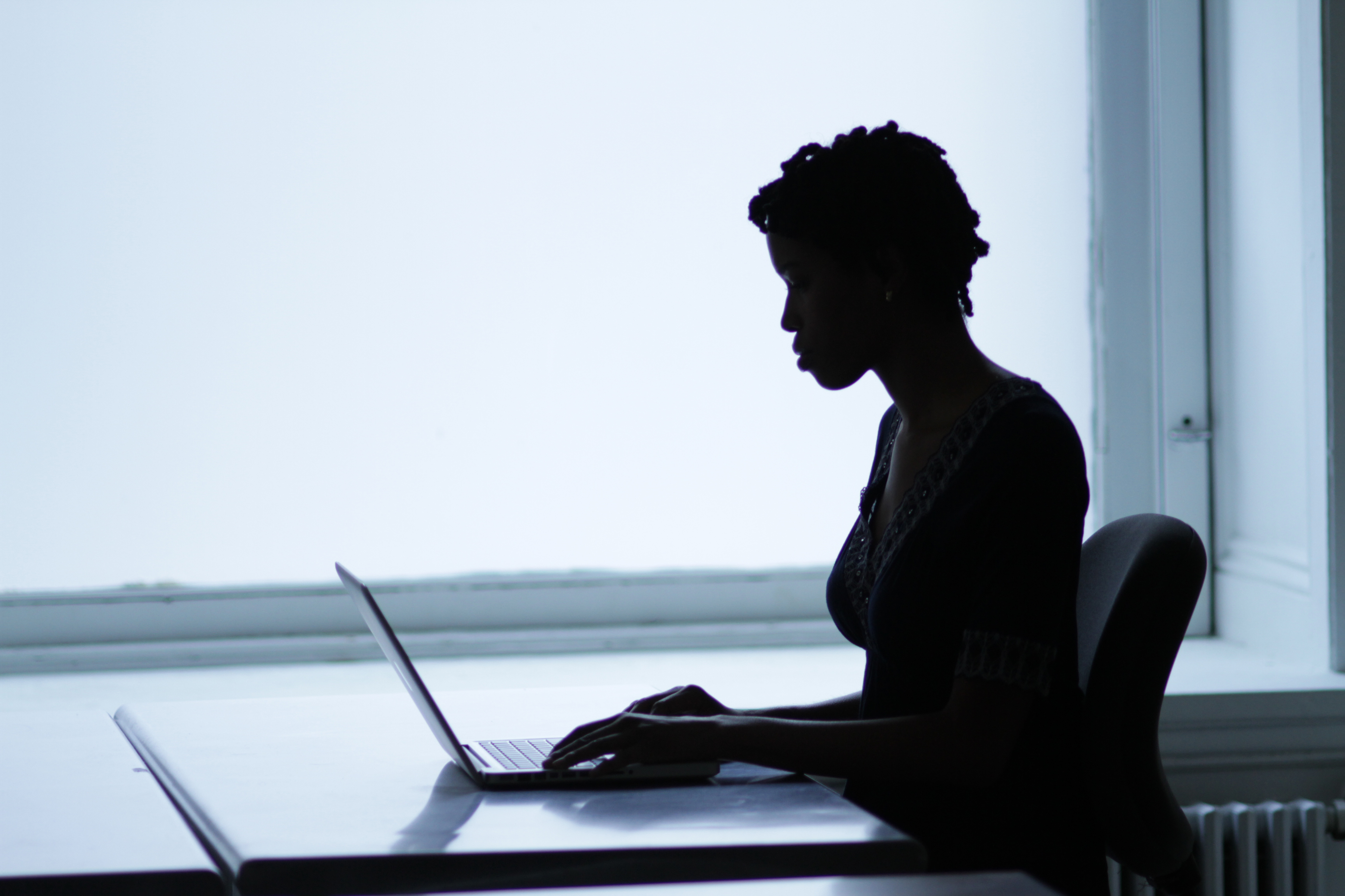 Woman with laptop working