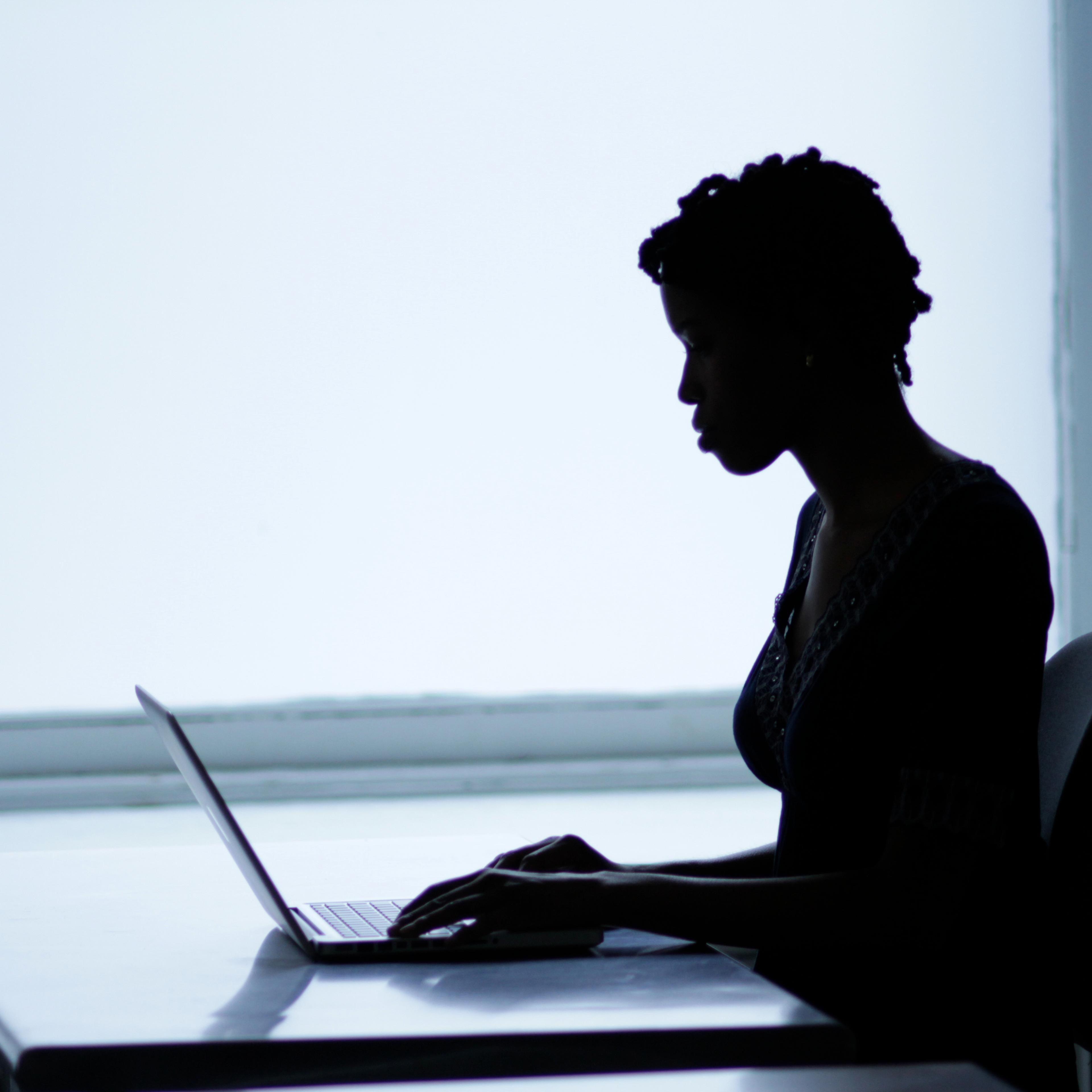 Woman with laptop working