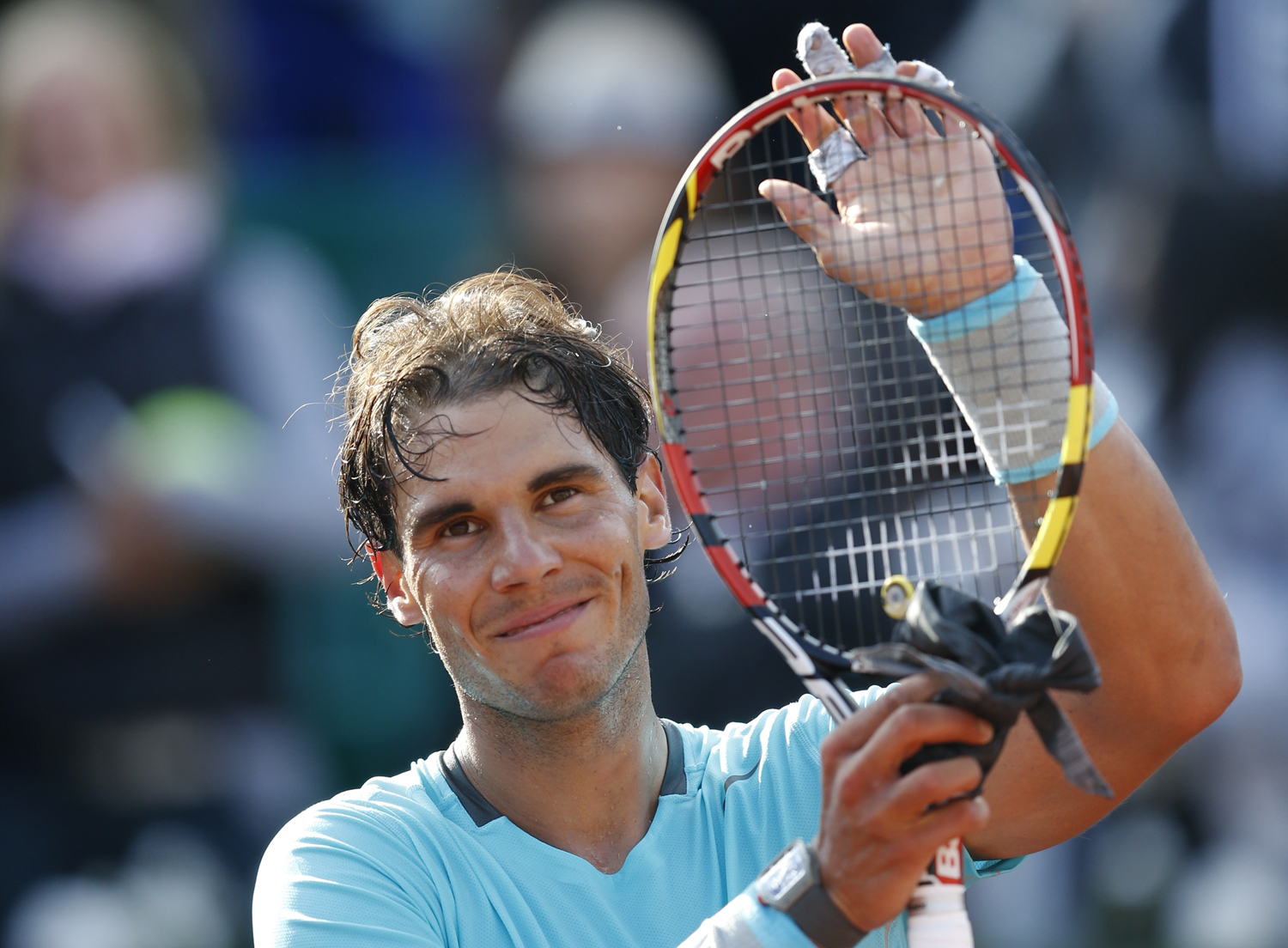 Nadal of Spain reacts after defeating Ginepri of the U.S. in their men's singles match at the French Open tennis tournament at the Roland Garros stadium in Paris