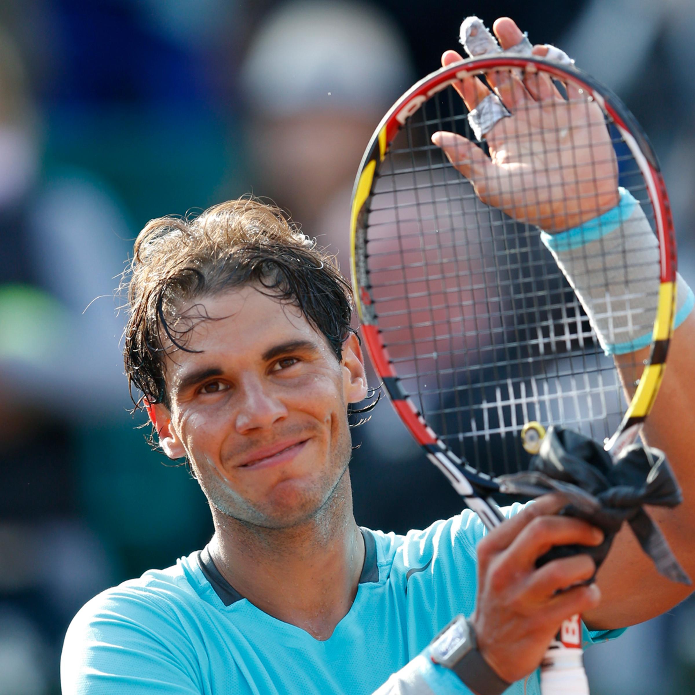 Nadal of Spain reacts after defeating Ginepri of the U.S. in their men's singles match at the French Open tennis tournament at the Roland Garros stadium in Paris