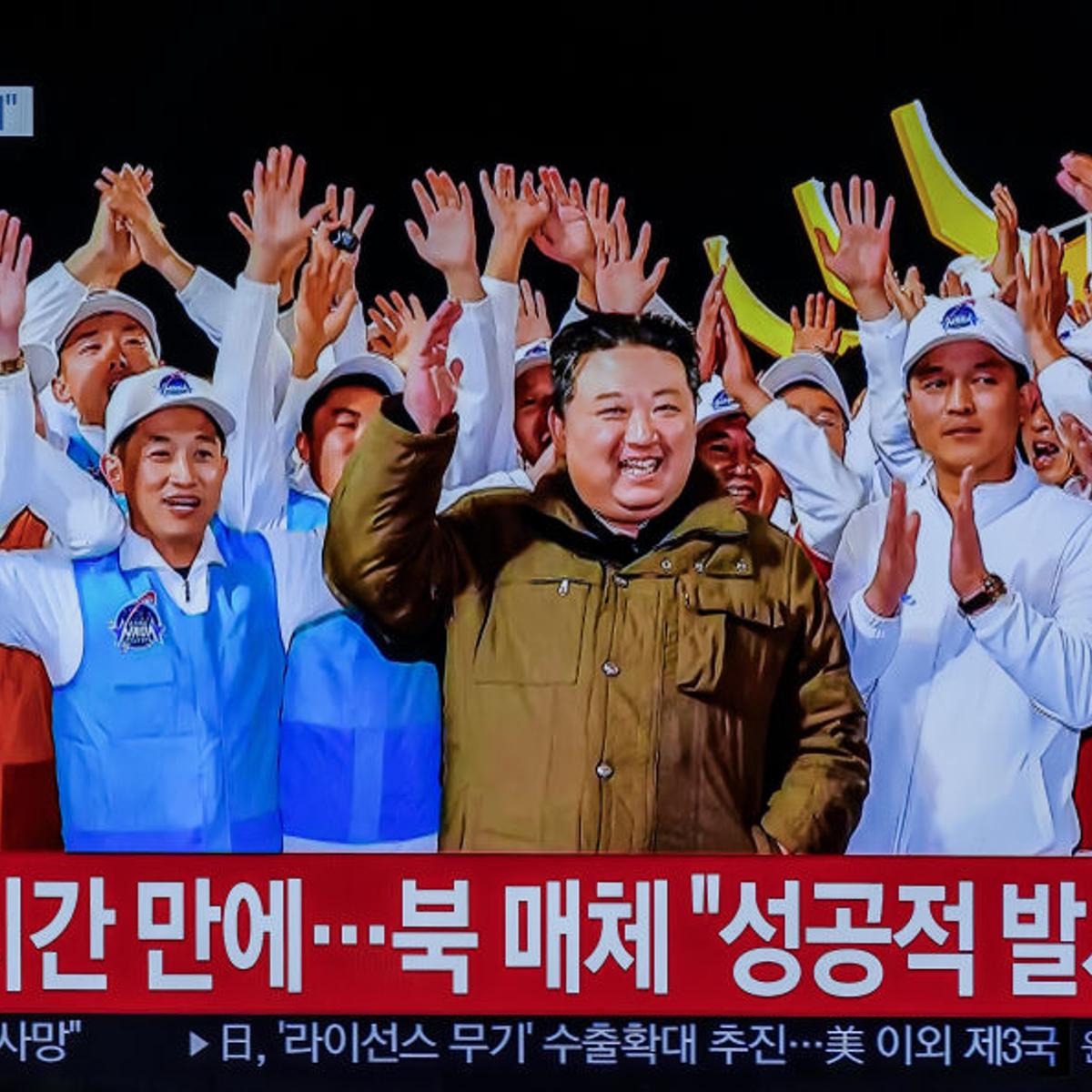A TV at Seoul's Yongsan Station shows North Korean leader Kim Jong Un and a report that North Korea's reconnaissance satellite, its third launch attempt this year, has entered orbit on Nov. 21, 2023.