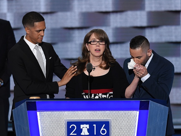 Christine Leinonen (C), mother of Christopher "Drew" Leinonen killed in the Pulse nightclub attack in Orlando, Florida, is joined by Brandon Wolf (L) and Jose Arriagada who survived the attack during the Democratic National Convention at the Wells Fargo 