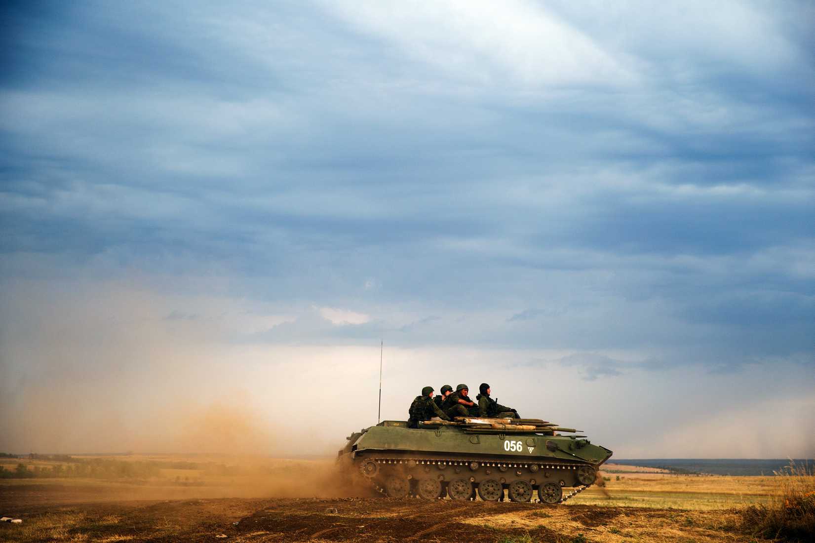 A Russian APC moves in a field in about 10 kilometers (6.2 miles) from the Russia-Ukrainian border control point at Russian town of Donetsk, Rostov-on-Don region on Aug. 18, 2014.