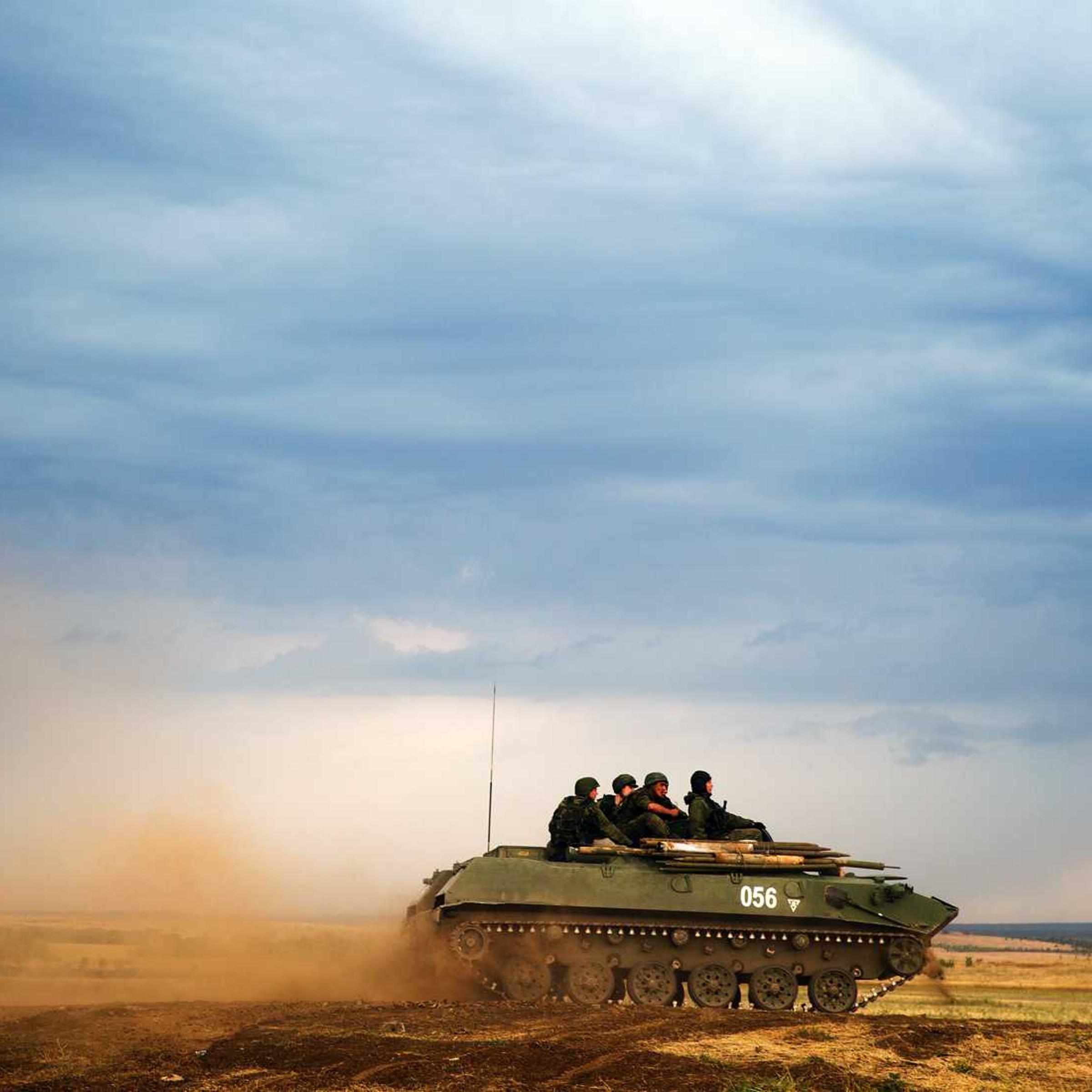 A Russian APC moves in a field in about 10 kilometers (6.2 miles) from the Russia-Ukrainian border control point at Russian town of Donetsk, Rostov-on-Don region on Aug. 18, 2014.