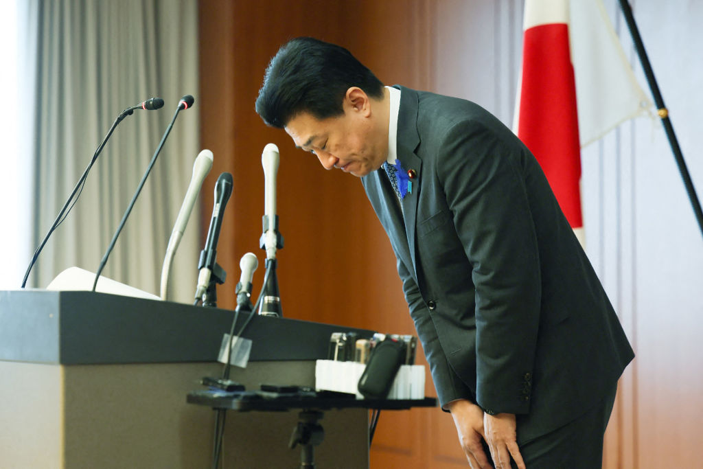 Japan's Defence Minister Minoru Kihara bows during a press conference at the Defence Ministry in Tokyo on July 12, 2024.