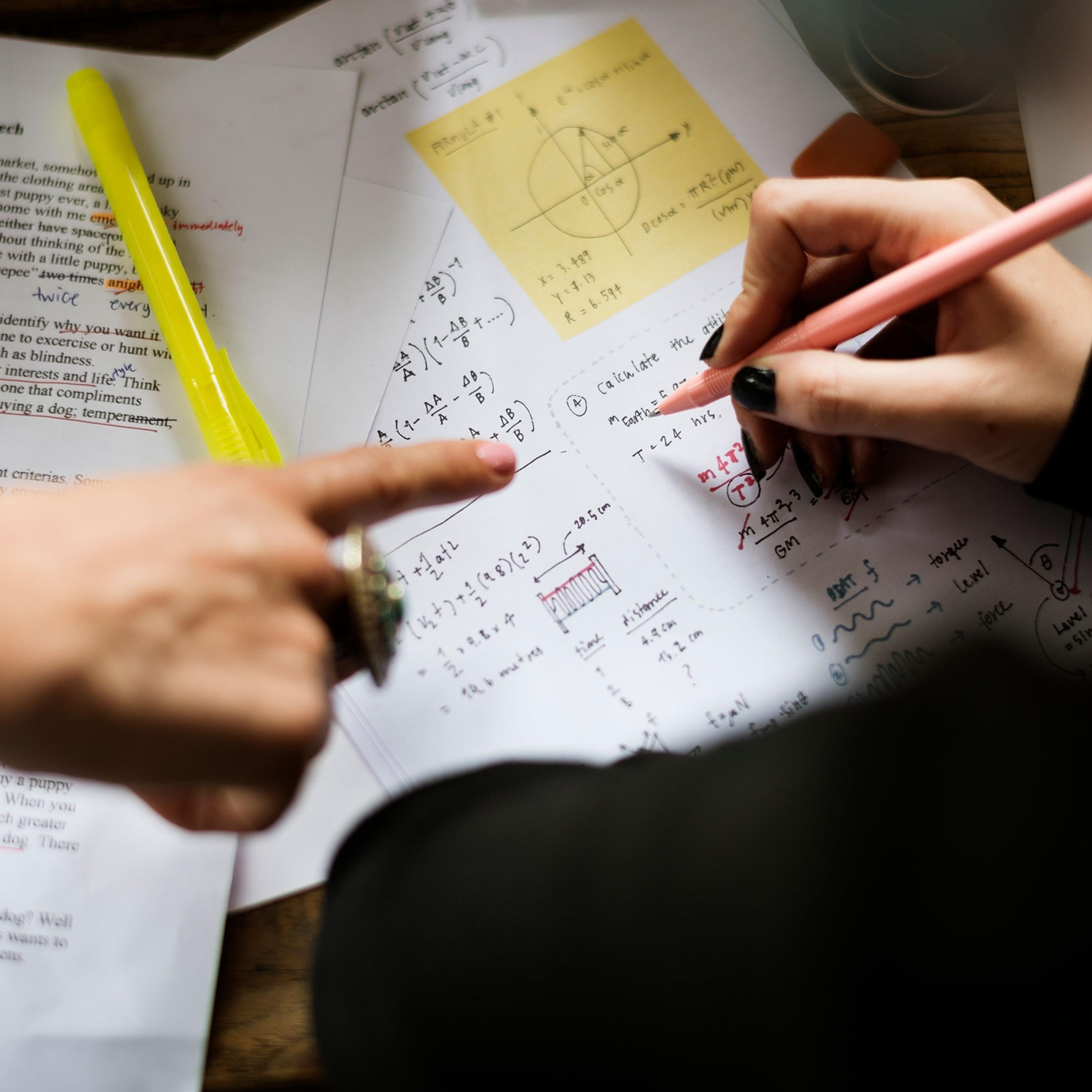 Hand Writing Working on Physics Assignment Study Education