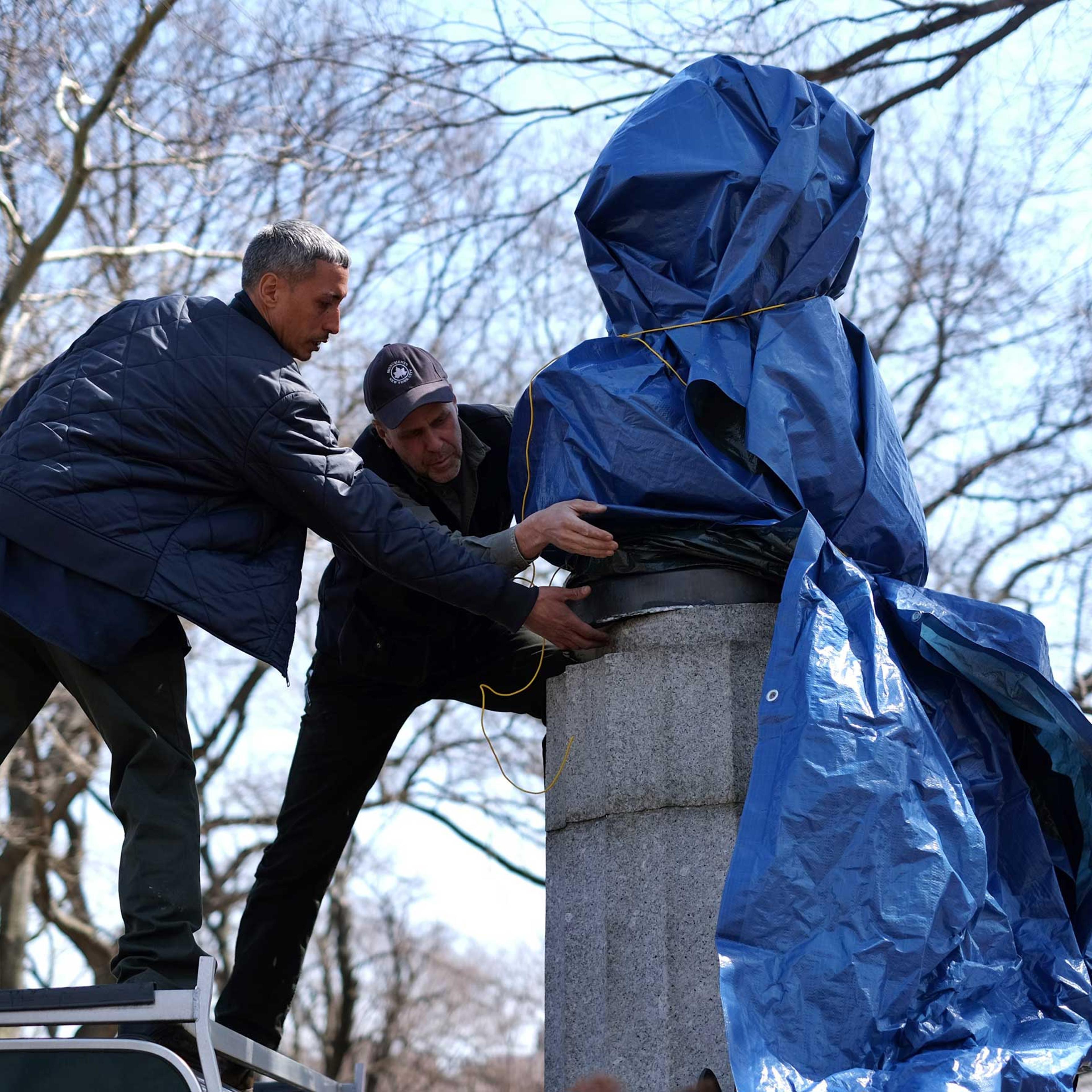 New York City Department of Parks and Recreation employees take down a statue of former National Security Agency (NSA) contractor Edward Snowden at the Fort Greene Park in Brooklyn, N.Y., on Apr. 6, 2015.