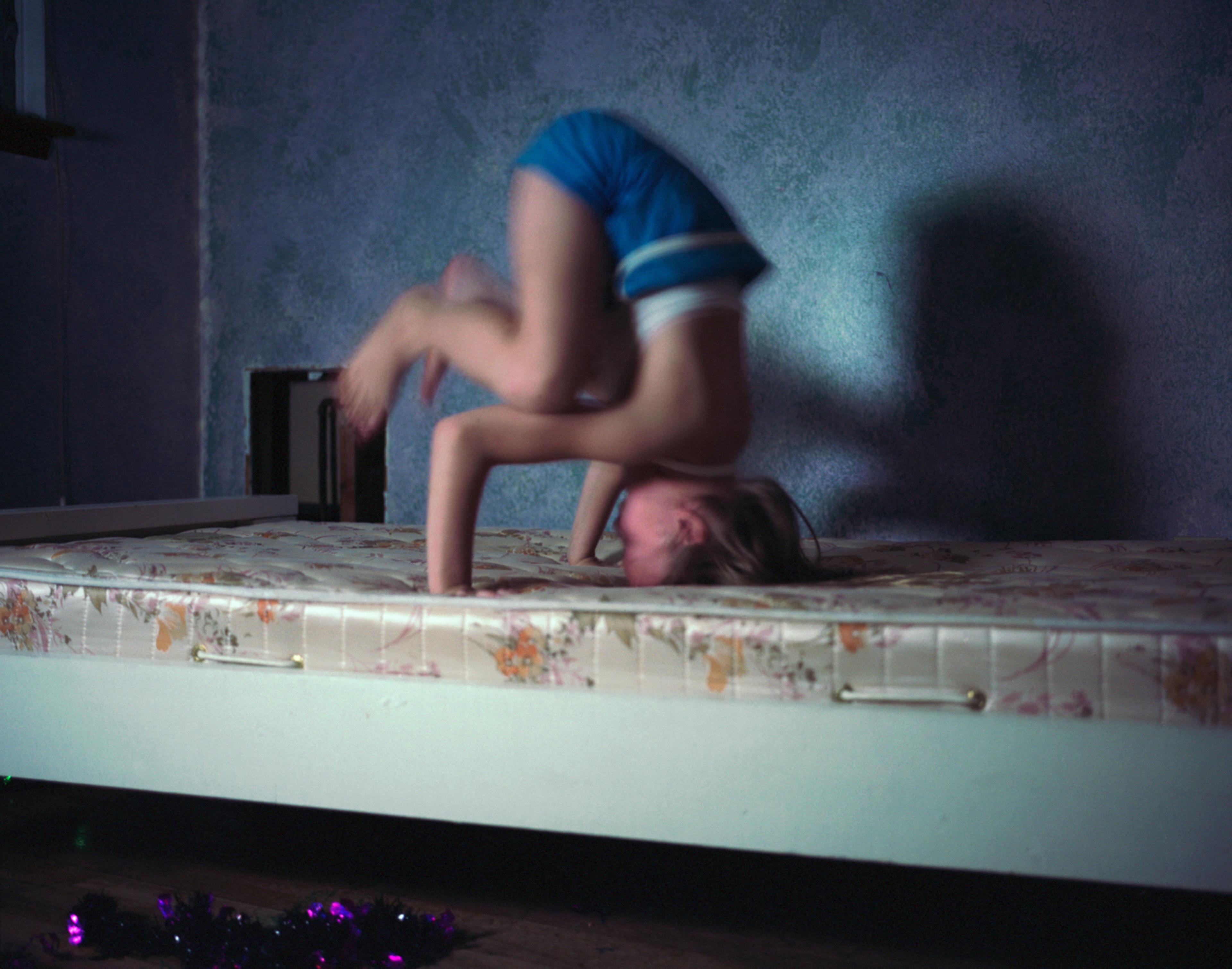 Watching cartoons and doing headstands. 2007