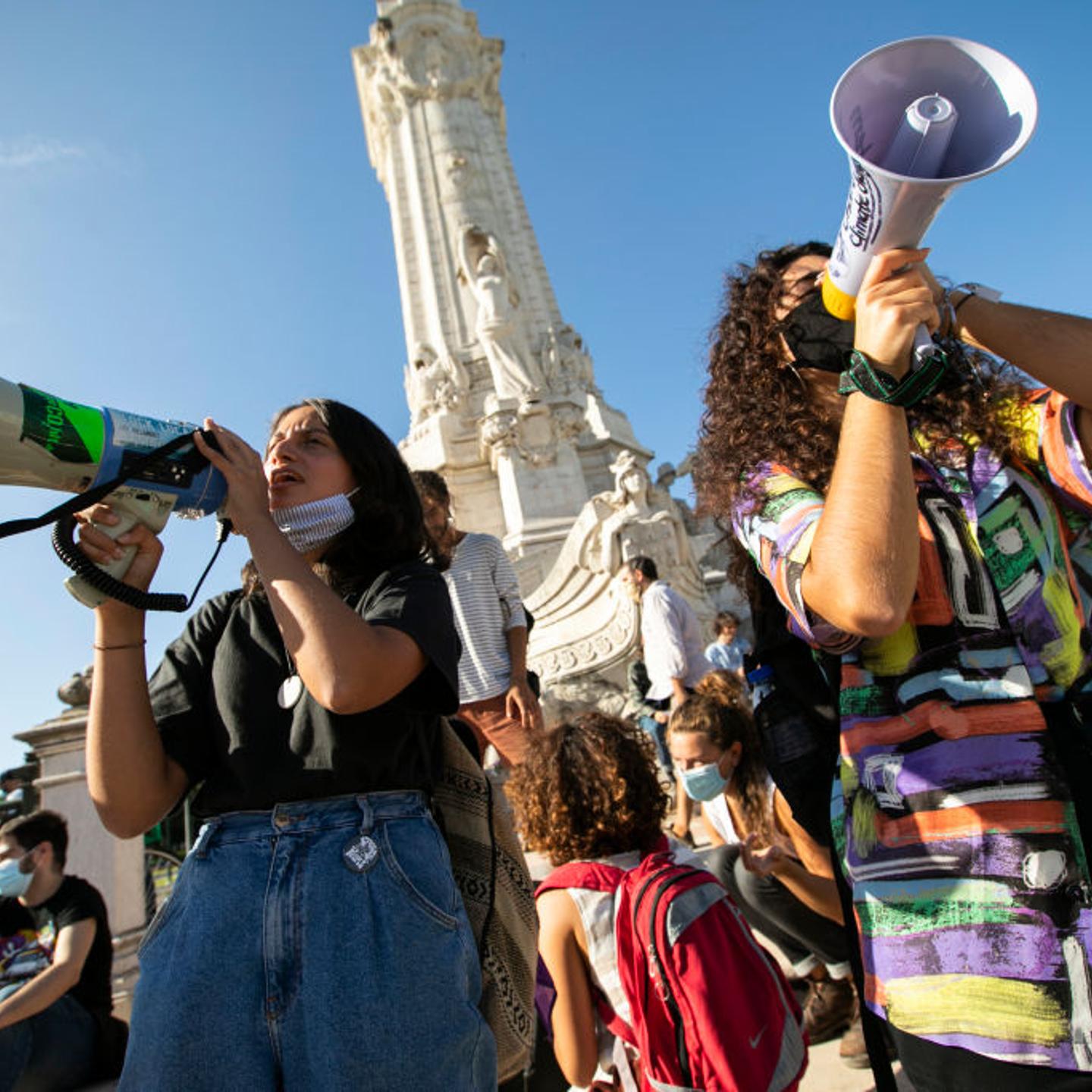 Protesters shouting slogans on megaphones during the climate