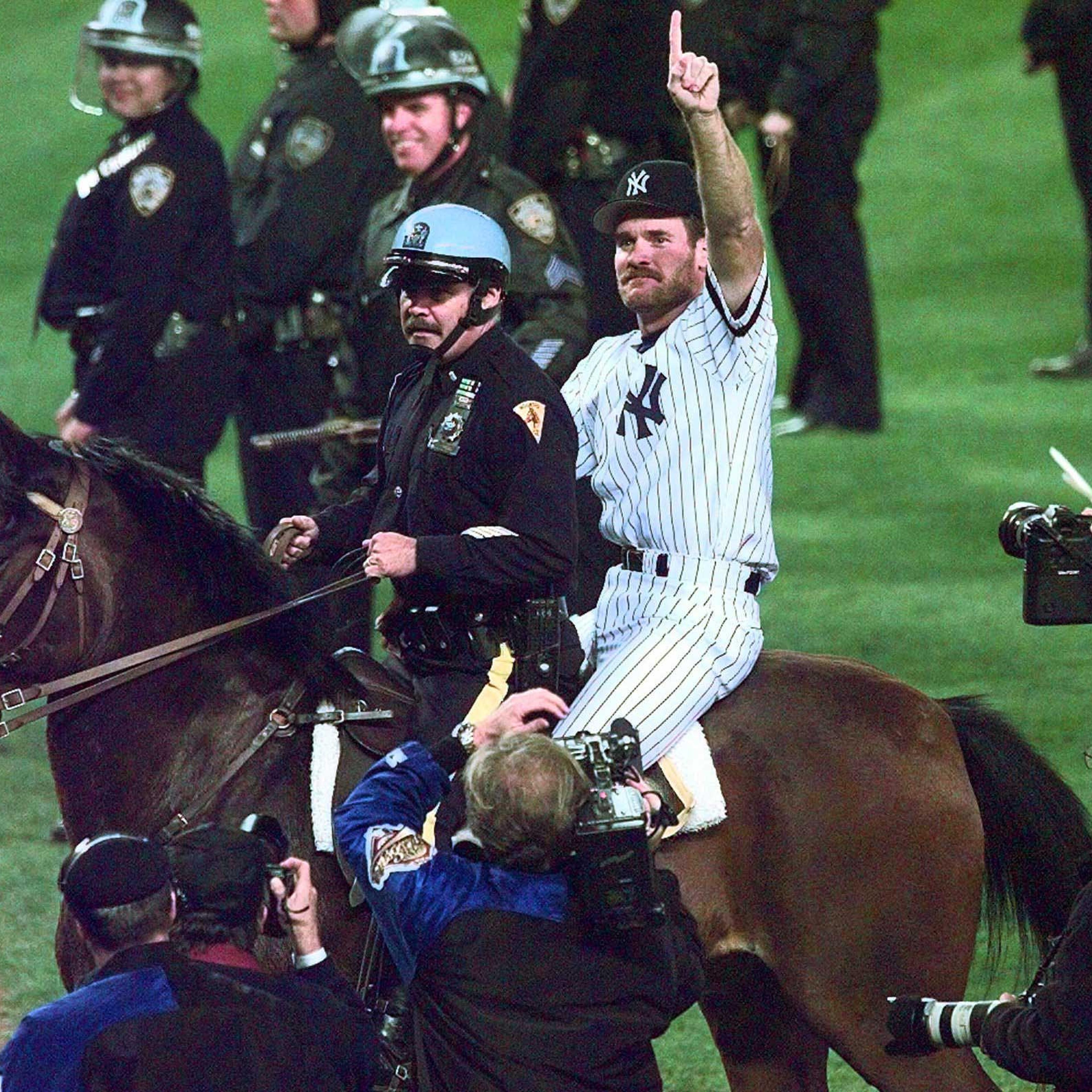 New York Yankees Wade Boggs rides a police horse around the field after the Yankees defeated the Atlanta Braves 3-2 in Game 6 of the World Series to win the Series at Yankee Stadium in New York, Saturday, Oct. 26, 1996.