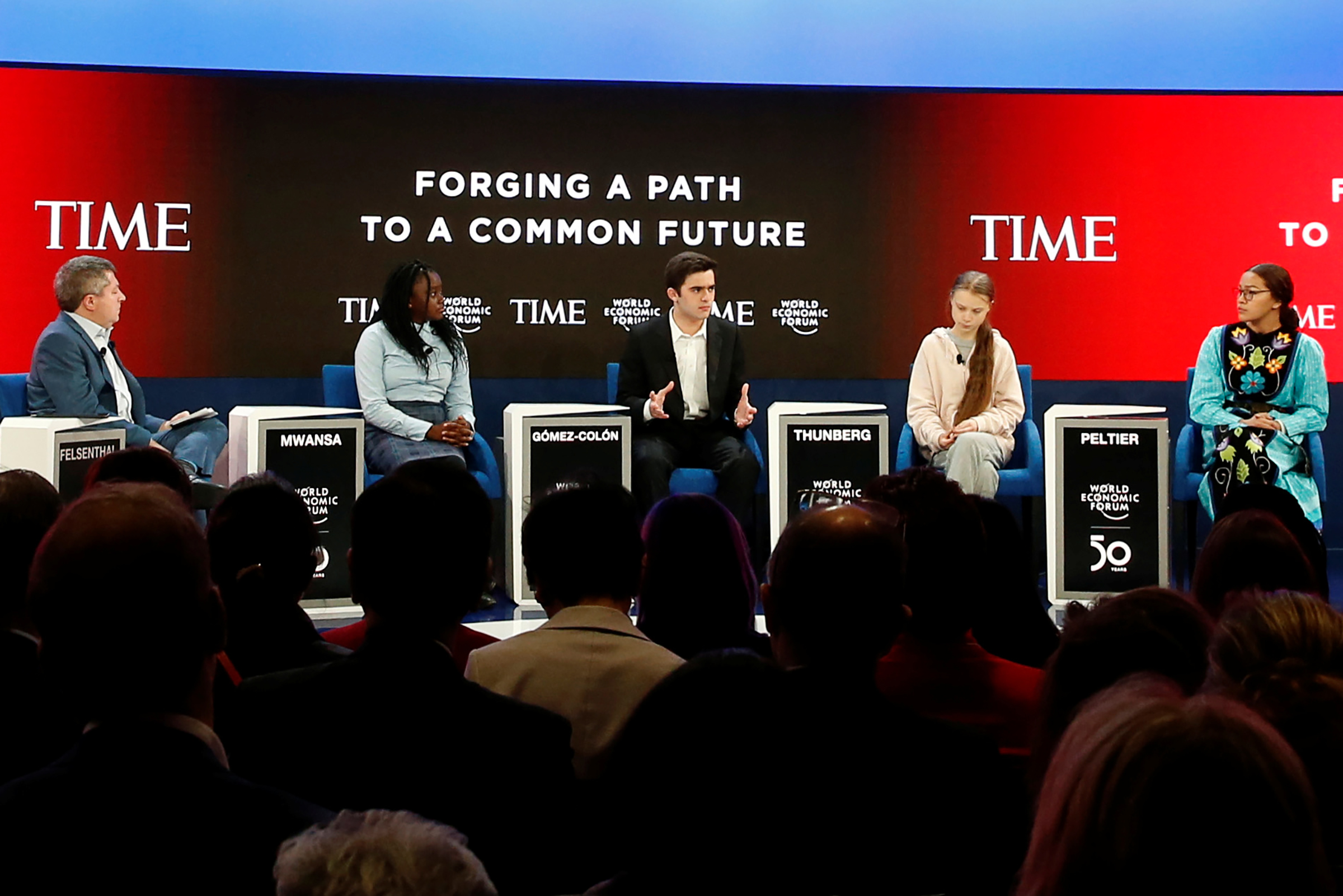 Salvador Gomez-Colon, center, speaks during a forum with TIME's Edward Felsenthal, left, Natasha Mwansa, Greta Thunberg and Autumn Peltier at the World Economic Forum in Davos, Switzerland, Jan. 21, 2020.