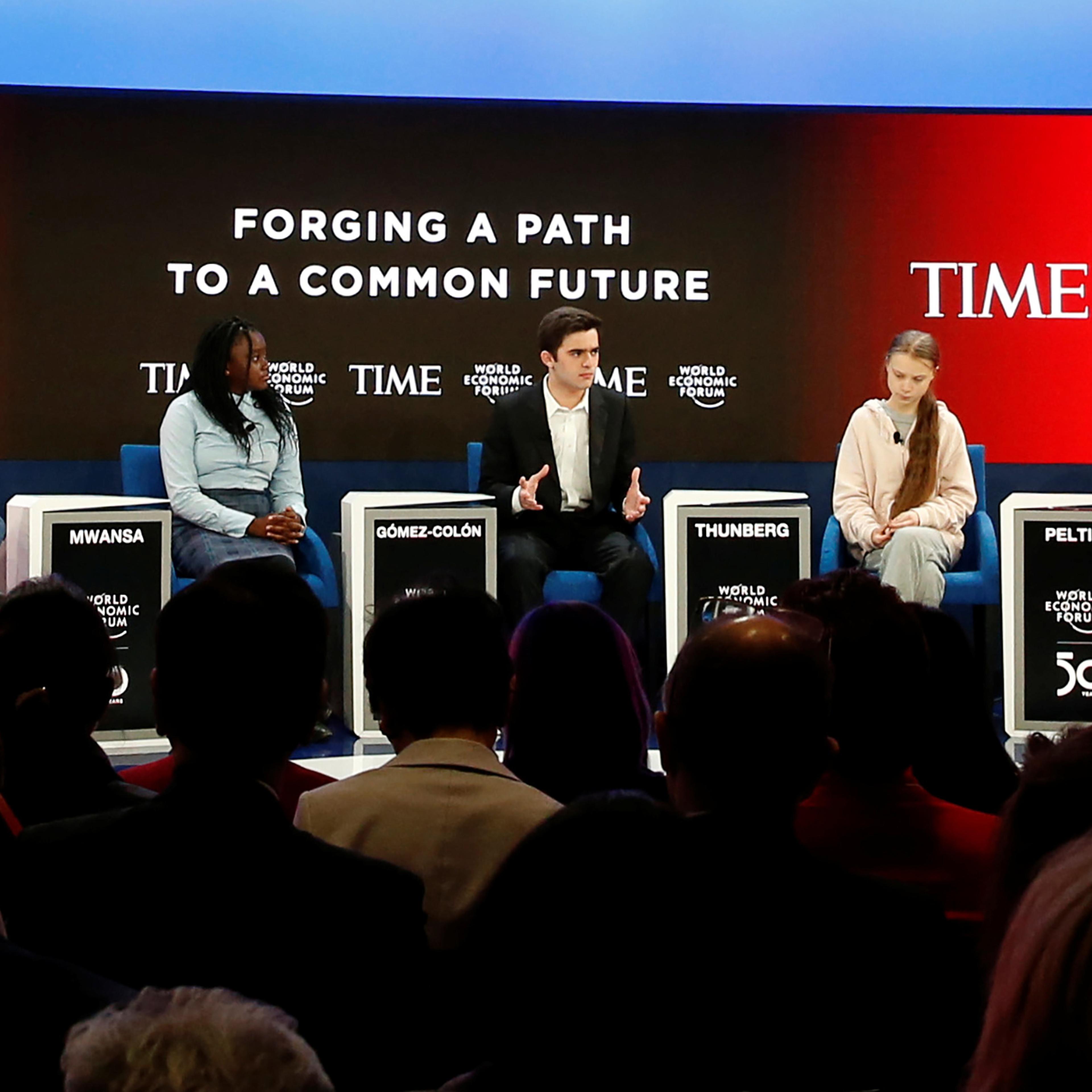 Salvador Gomez-Colon, center, speaks during a forum with TIME's Edward Felsenthal, left, Natasha Mwansa, Greta Thunberg and Autumn Peltier at the World Economic Forum in Davos, Switzerland, Jan. 21, 2020.