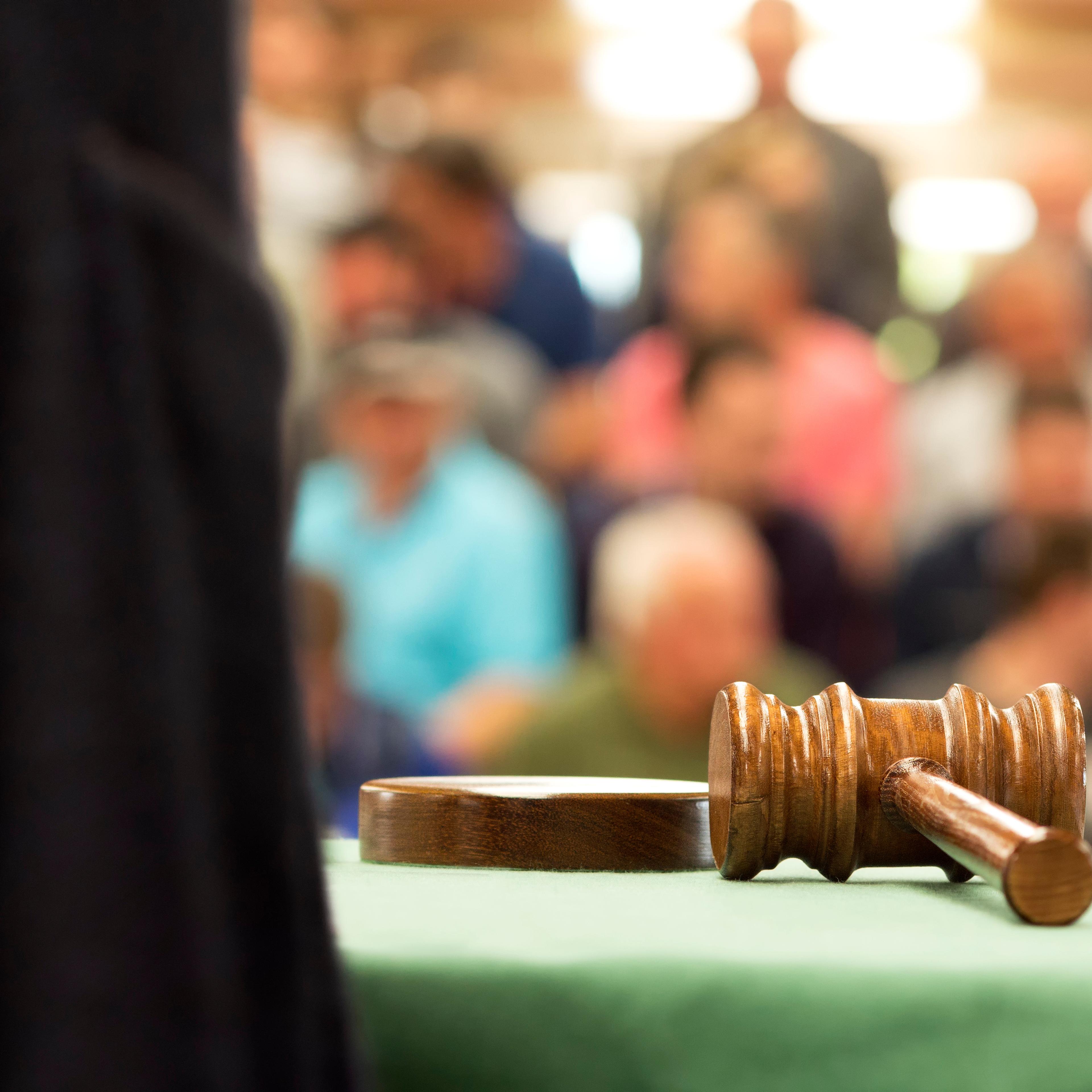 Close-Up Of Gavel On Table