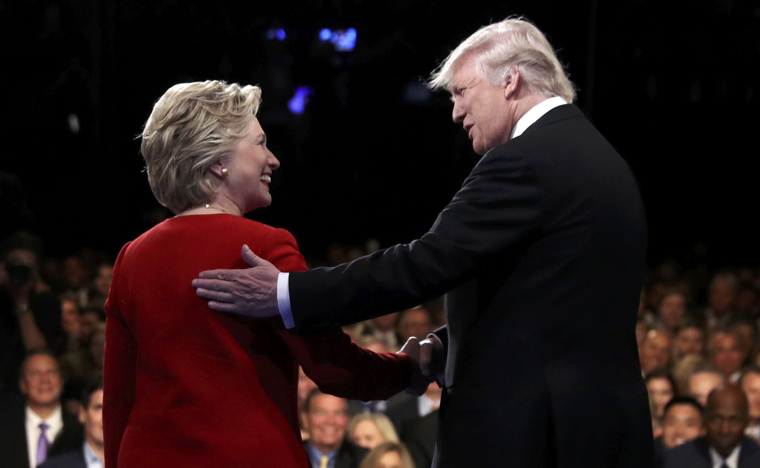 Republican U.S. presidential nominee Donald Trump shakes hands with Democratic U.S. presidential nominee Hillary Clinton at the start of their first presidential debate at Hofstra University in Hempstead