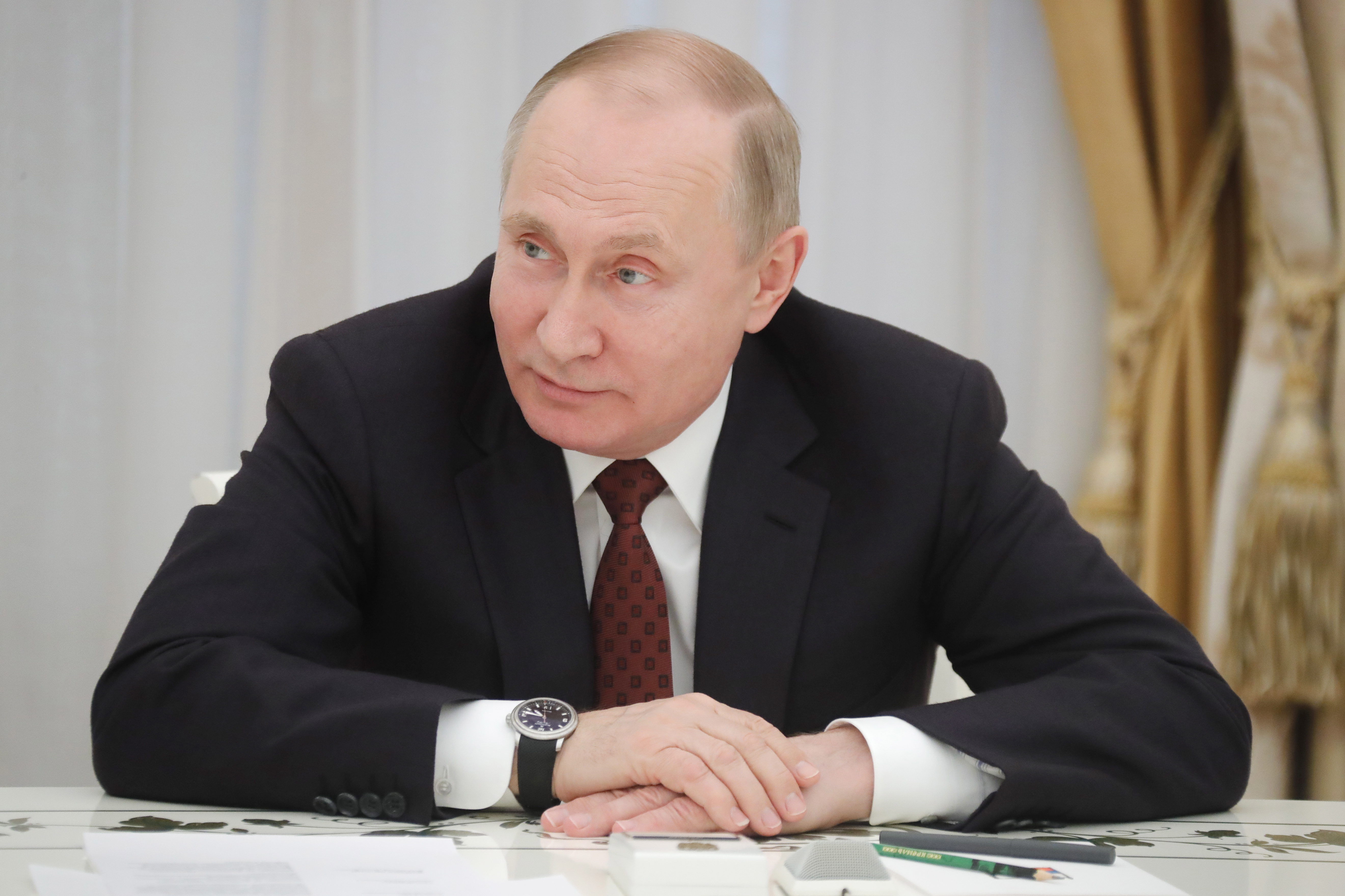 Russian President Putin meets with presidential candidates in Moscow