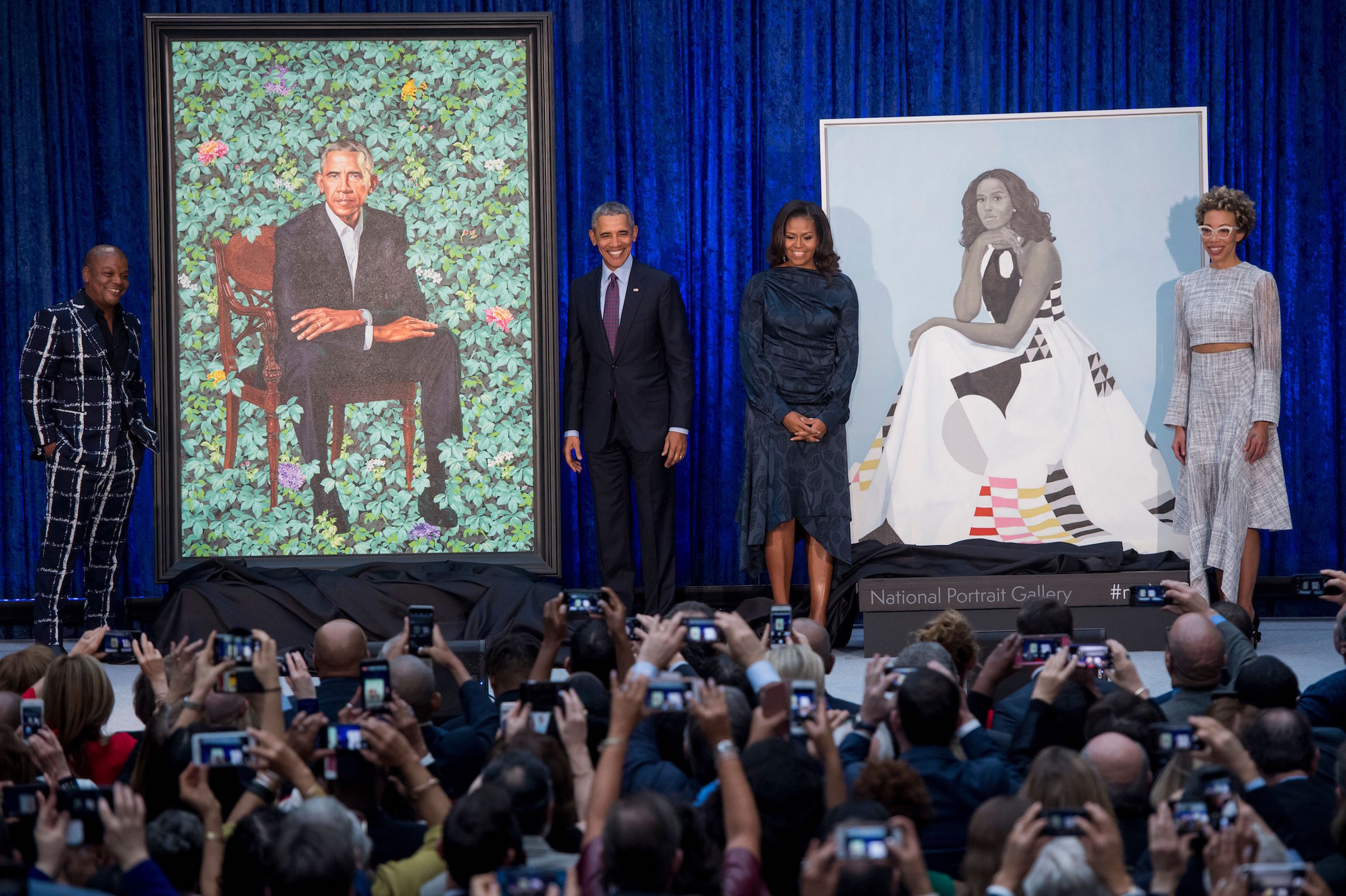 Barack and Michelle Obama with portraits by Kehinde Wiley and Amy Sherald