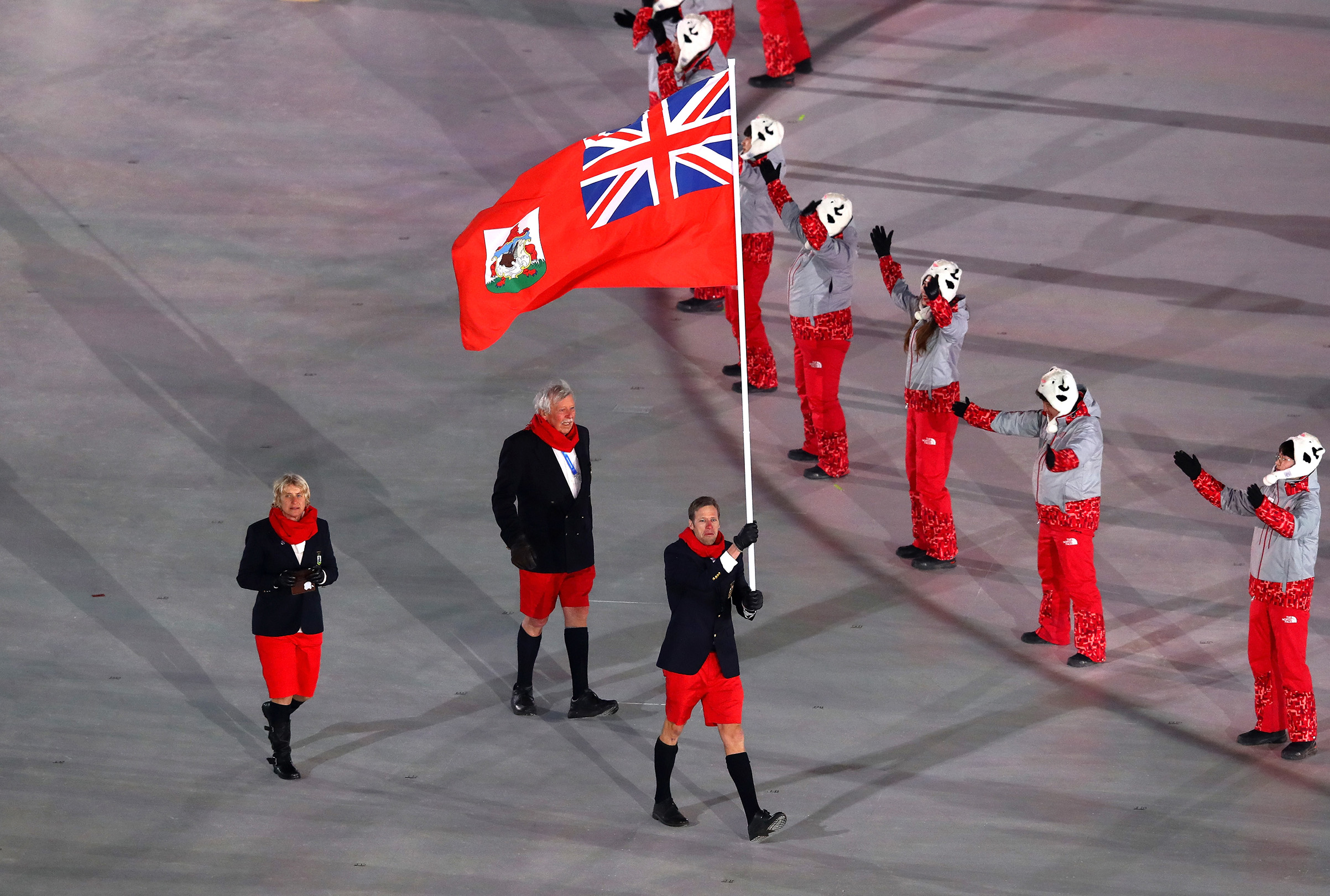 Flag bearer Tucker Murphy of Bermuda and teammates enter the stadium during the Opening Ceremony of the PyeongChang 2018 Winter Olympic Games at PyeongChang Olympic Stadium on Feb. 9, 2018.