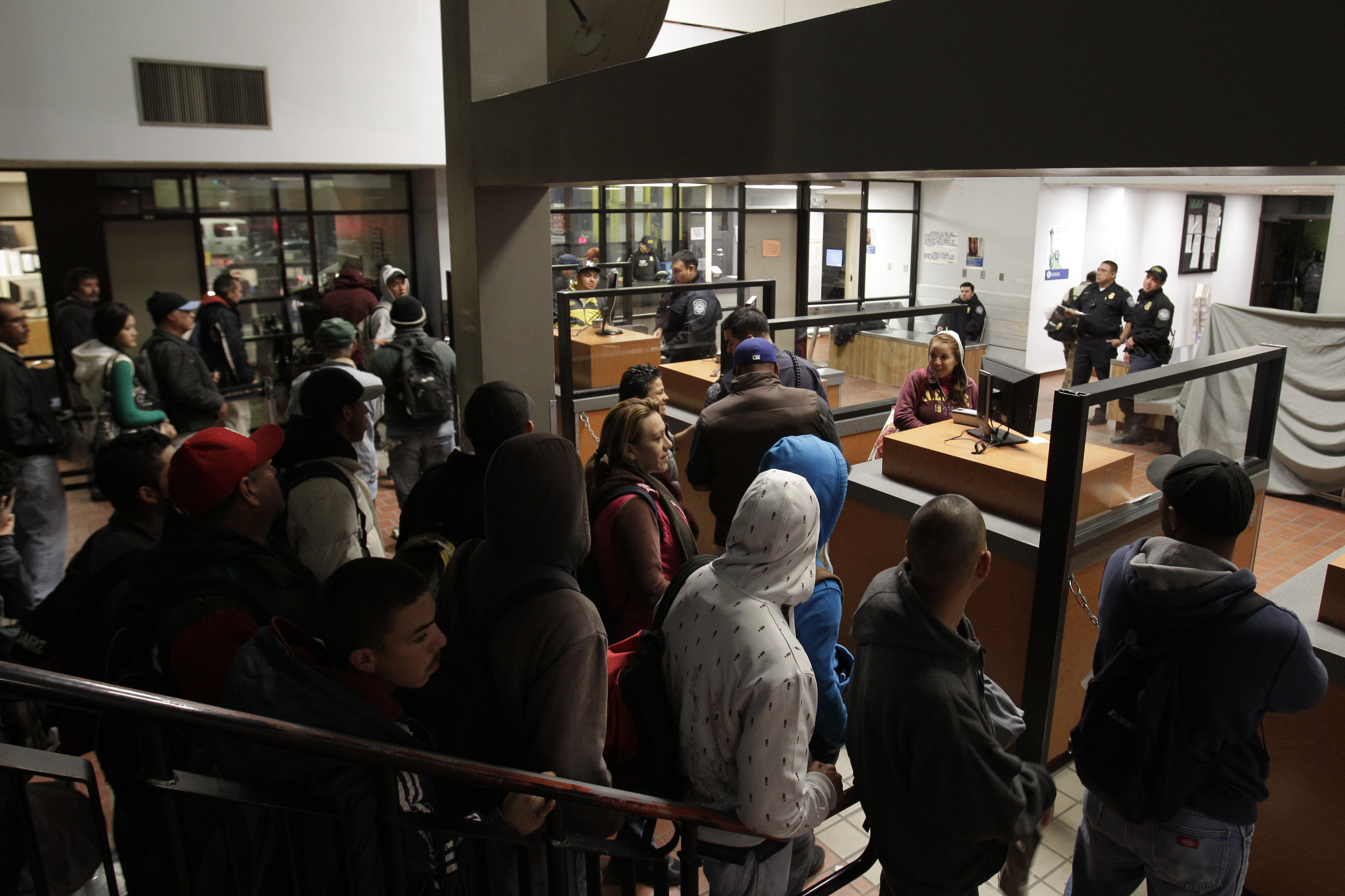In this Feb. 1, 2012 file photo, people line up to cross into the United States from Mexicali, Mexico, before dawn in Calexico, Calif. More Mexicans are leaving the United States than coming to the country, marking a reversal to one of the most significa