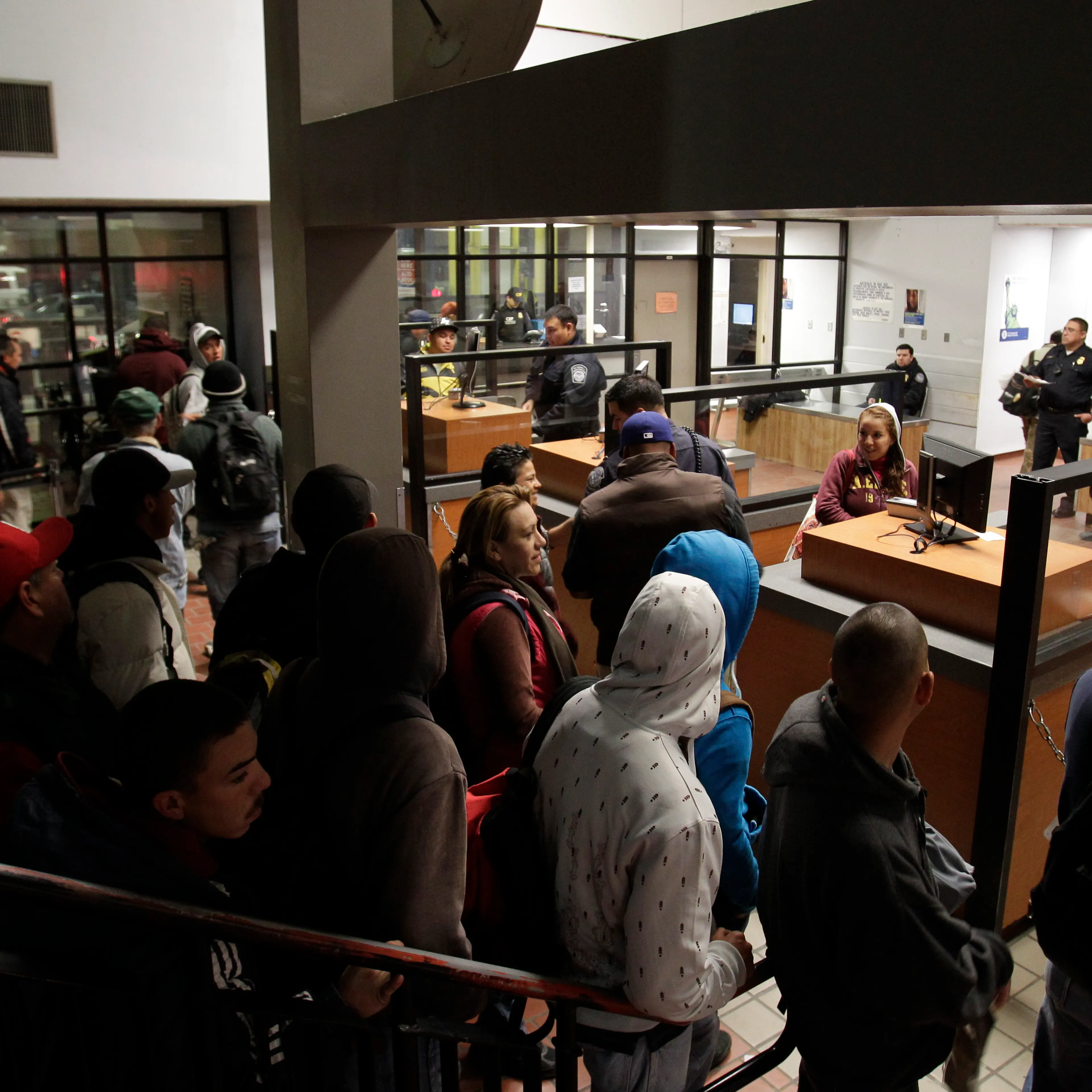In this Feb. 1, 2012 file photo, people line up to cross into the United States from Mexicali, Mexico, before dawn in Calexico, Calif. More Mexicans are leaving the United States than coming to the country, marking a reversal to one of the most significa