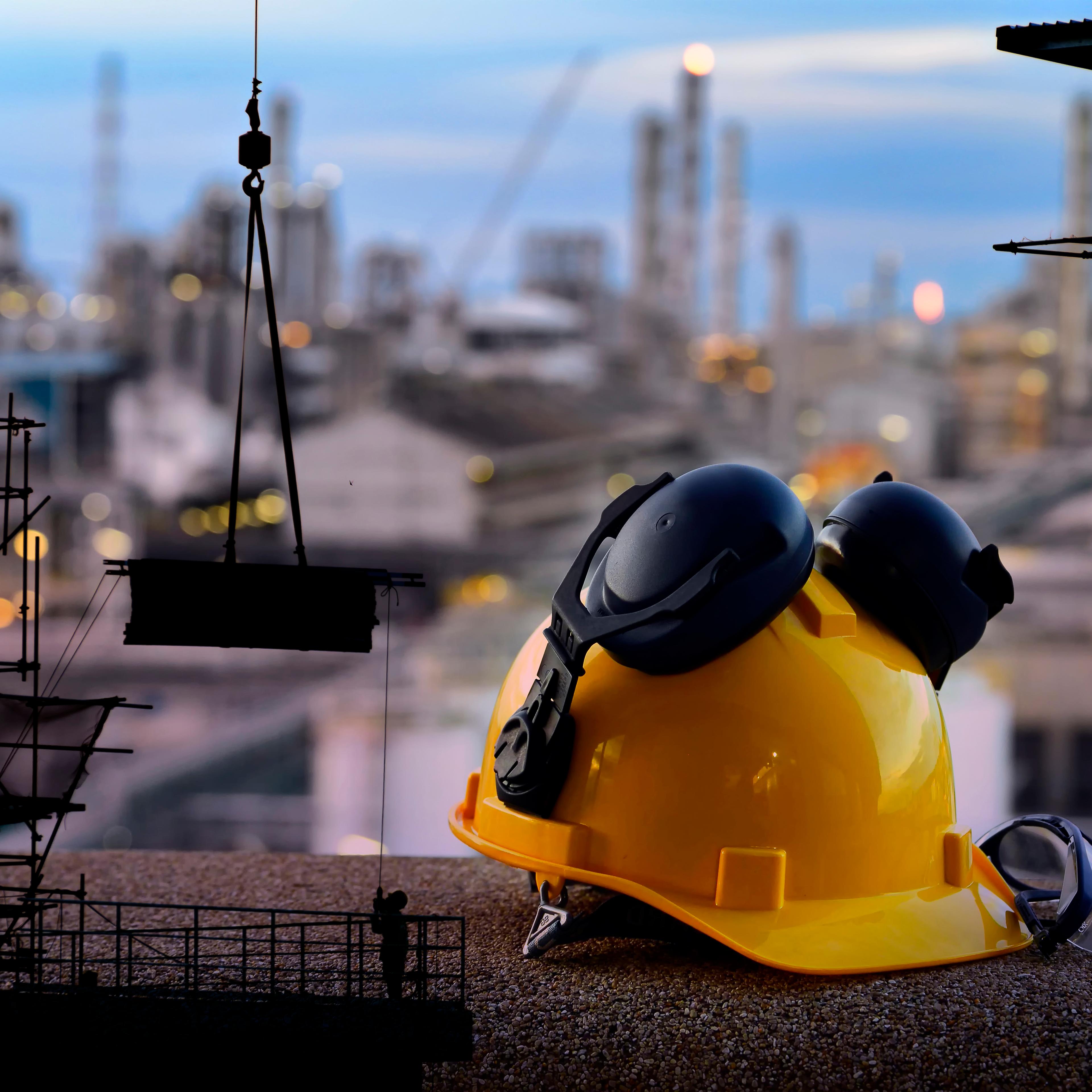 Set of safety work wear on construction background ,Work safety at construction site concept .