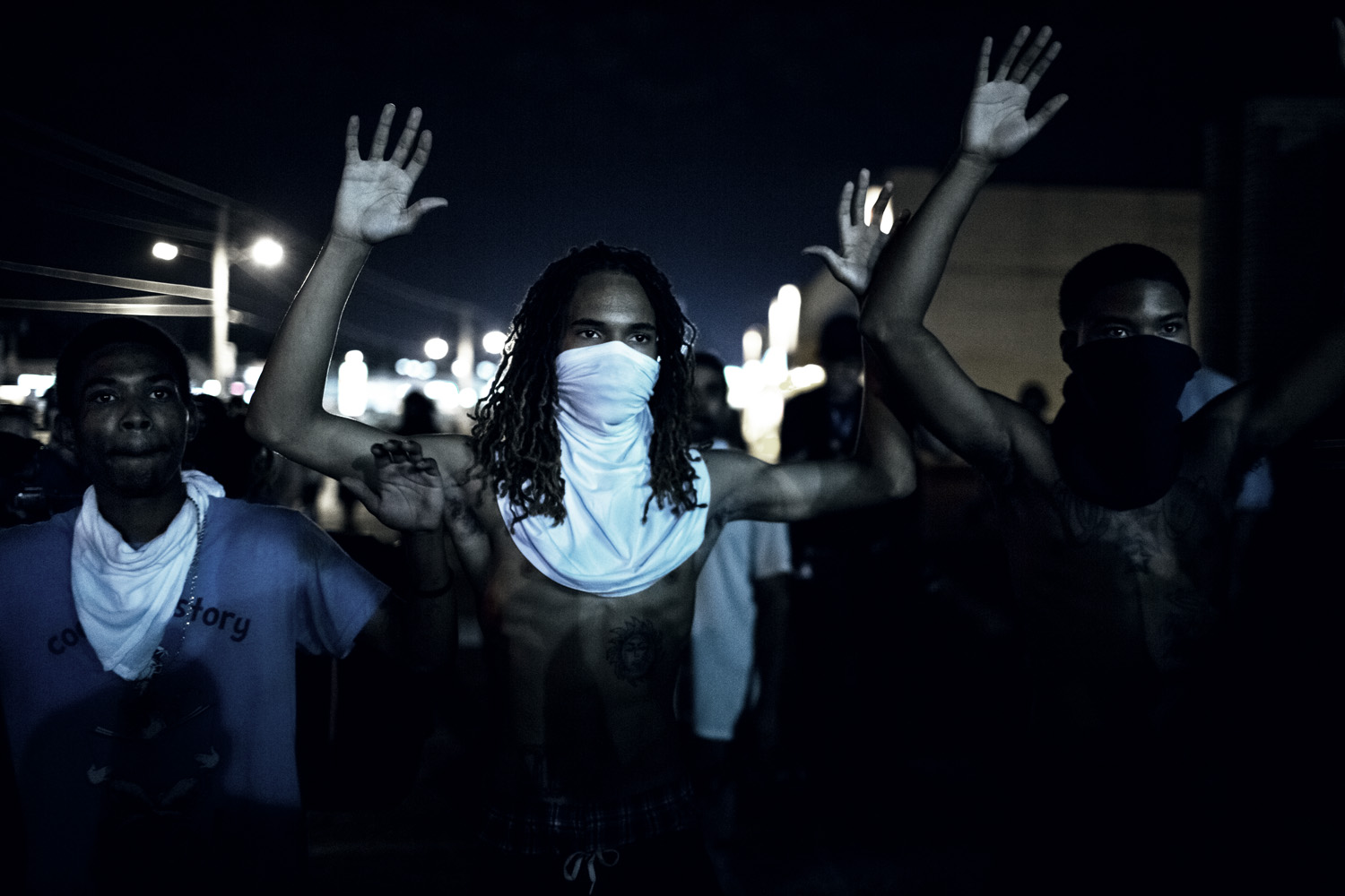 Demonstraters during clashes with police that erupted folwoing a mostly peacful protest at 12:30 AM on Wednesday, Aug 20, 2014 in Furguson, MO.