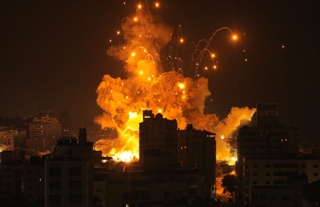 A missile explodes in Gaza City during an Israeli air strike on October 8, 2023. Israel, reeling from the deadliest attack on its territory in half a century, formally declared war on Hamas Sunday as the conflict's death toll surged close to 1,000 after 